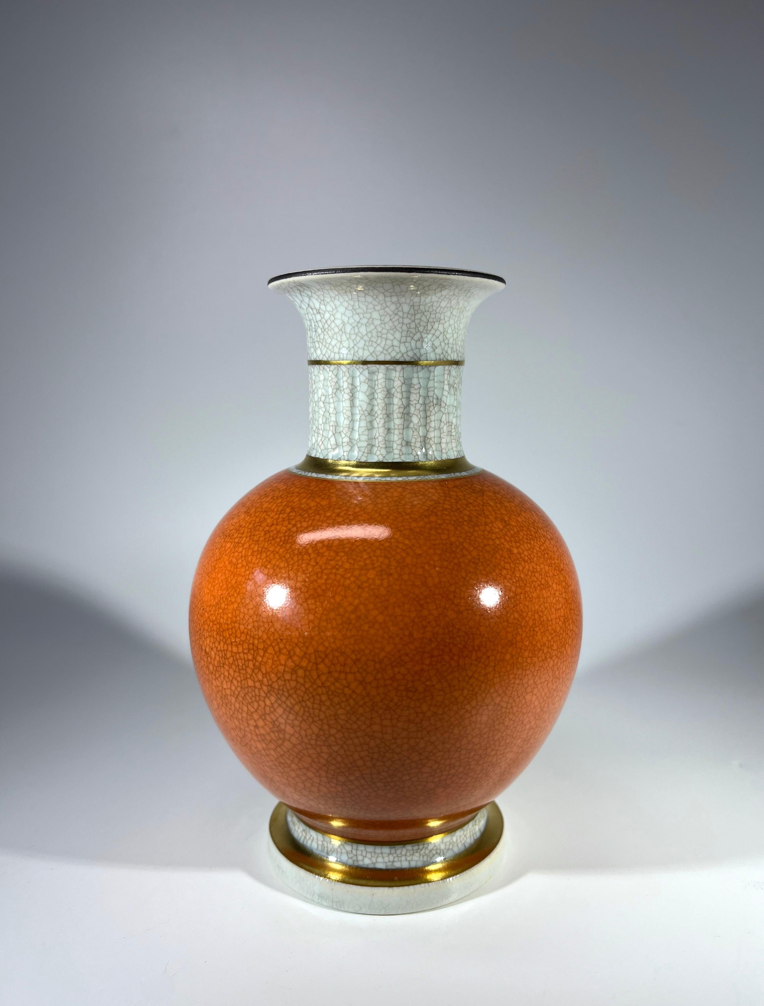 Thorkild Olsen for Royal Copenhagen porcelain terracotta and grey crackle glazed ball shaped vase with gilded banding on neck and base.
Circa 1968
Stamped and numbered 3033
Height 5.5 inch, Diameter 3.75 inch
Very good condition.
Wear consistent