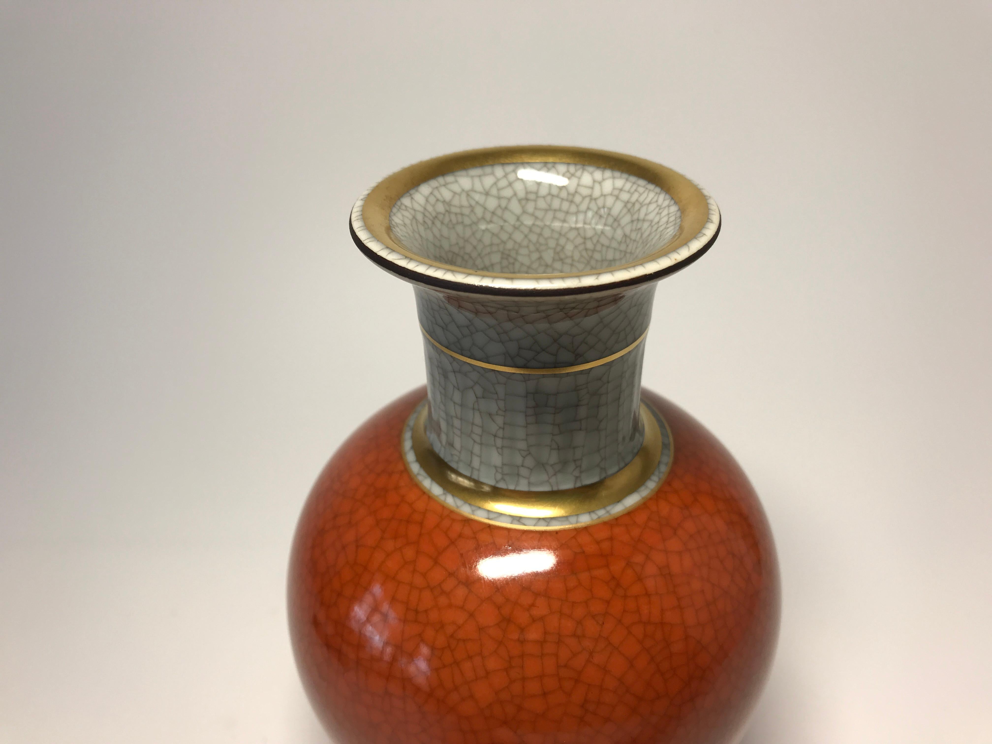 Thorkild Olsen for Royal Copenhagen porcelain terracotta and grey crackle vase with beautiful gilt banding on neck and base,
circa 1969-1973
Stamped and numbered 3033
Excellent example of Royal Copenhagen. Tiny underglaze spot on orange body (see