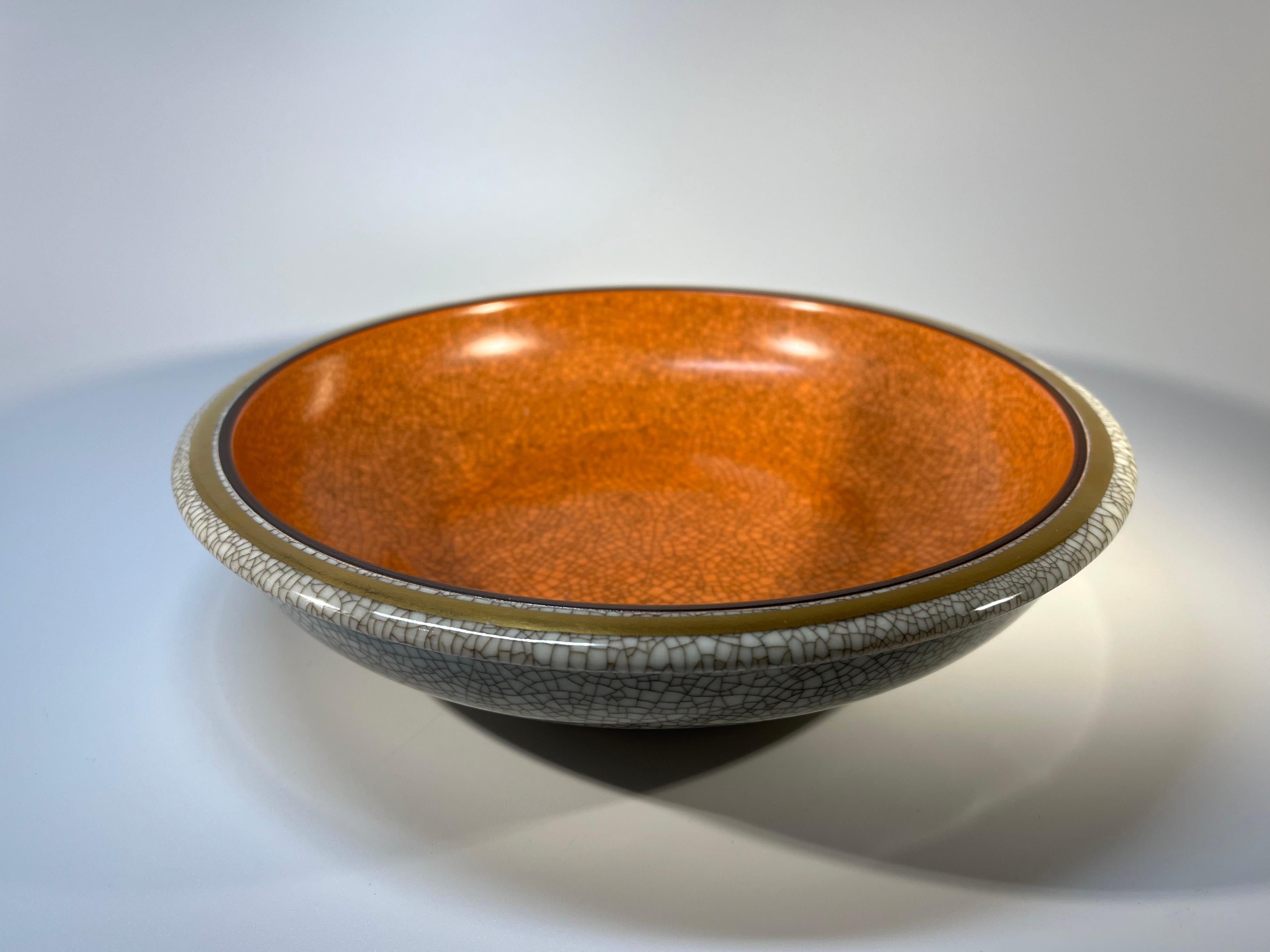 Thorkild Olsenl terracotta matt glaze dish for Royal Copenhagen
A large functional piece decorated with gilded band to rim
Circa 1954
Stamped and numbered 3606
Height 2 inch, Diameter 9.75 inch
In good condition. Note, this piece is factory marked B