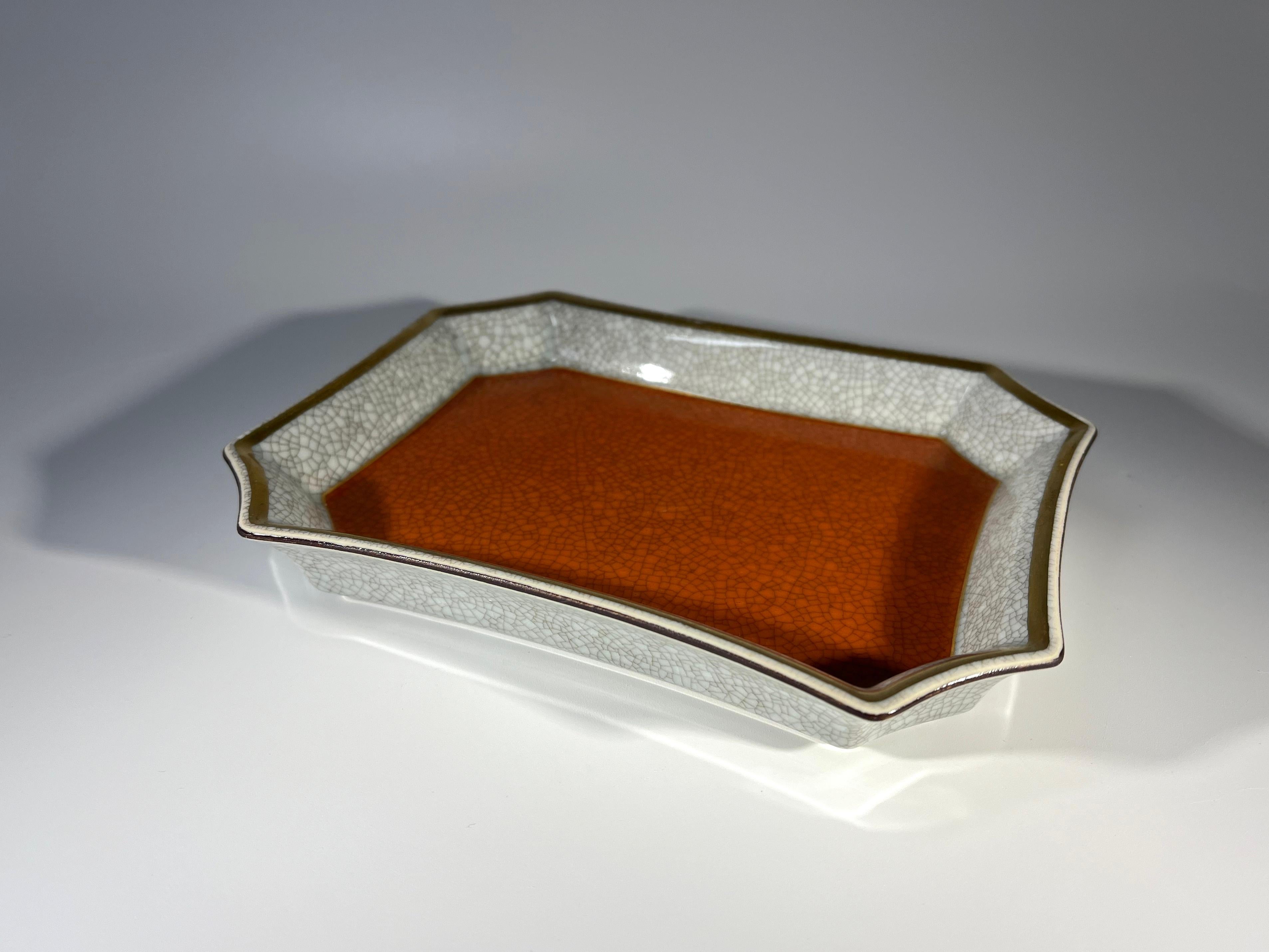 Thorkild Olsen for Royal Copenhagen, terracotta and grey crackle glazed porcelain vide poche. 
Edged with gilded banding - an elegant and useful little tray
Signed and numbered 3391. 
Dated 1968
Height 1 inch, Width 6.5 inch, Depth 5.25 inch
In good