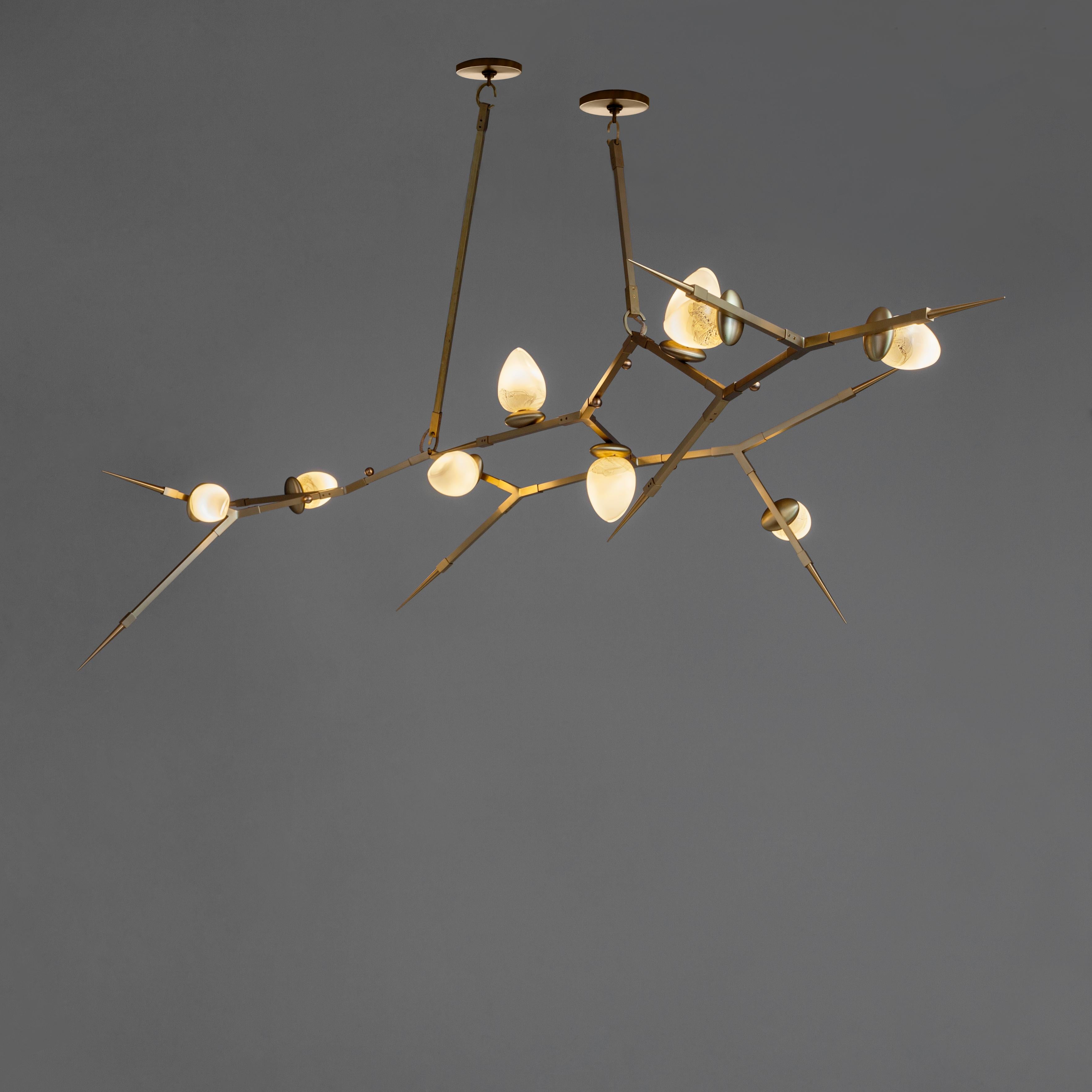 This scalable mobile chandelier, designed by Andrea Claire, uses a flexible system, shown here with (9) 4.5 watt dimmable LED bulbs. Thorn 100 chandelier can grow from 5 glass Orebs to 20, or more. We will customize this stunning fixture to fit your