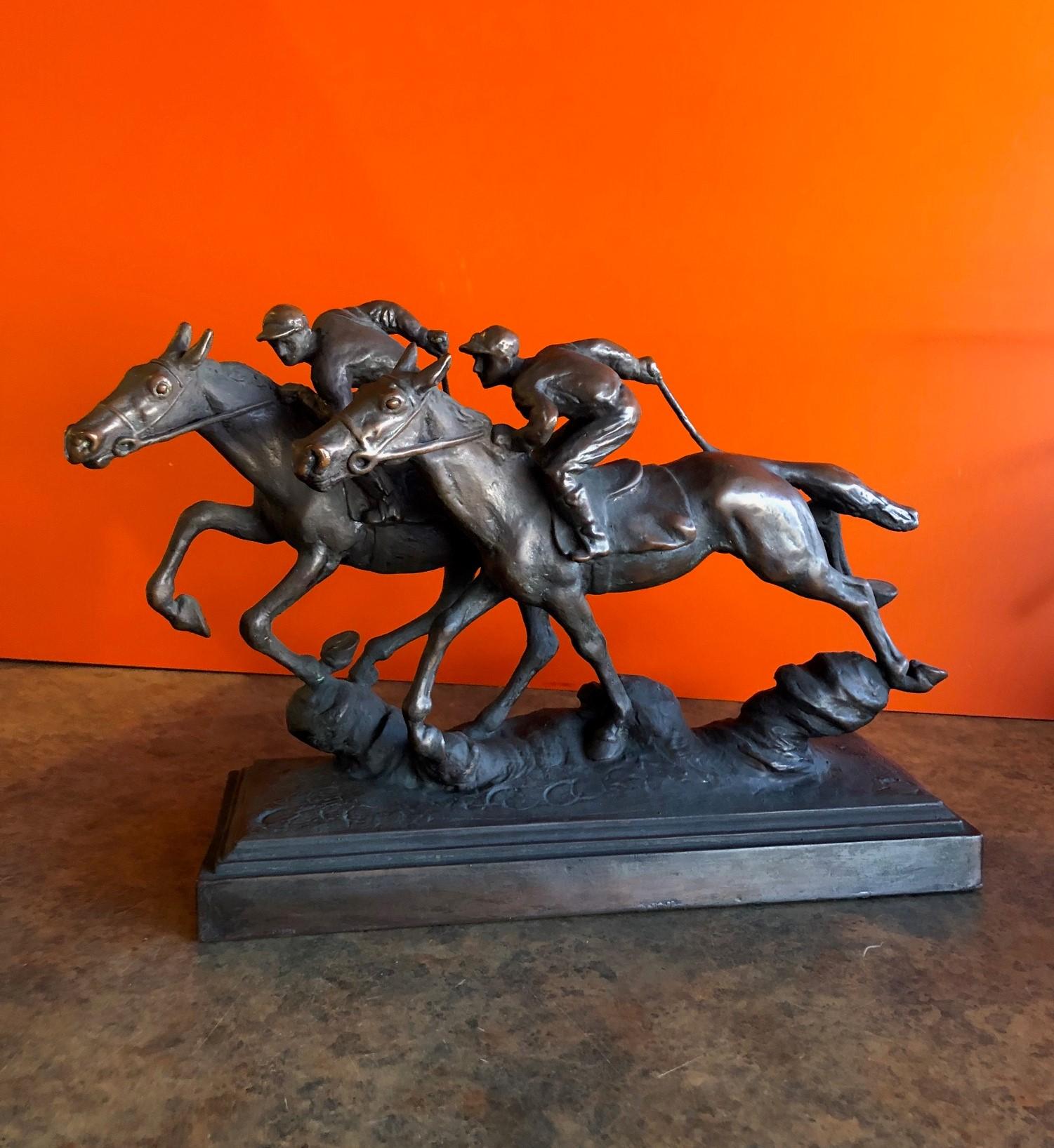 Wonderful bronze sculpture of two thoroughbred horses racing with jockeys aboard by Paul Herzel, circa 1930s. Great detail and patina!

 