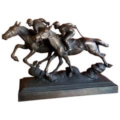 Sculpture en bronze de Paul Herzel représentant une course de chevaux de race Thoroughbred