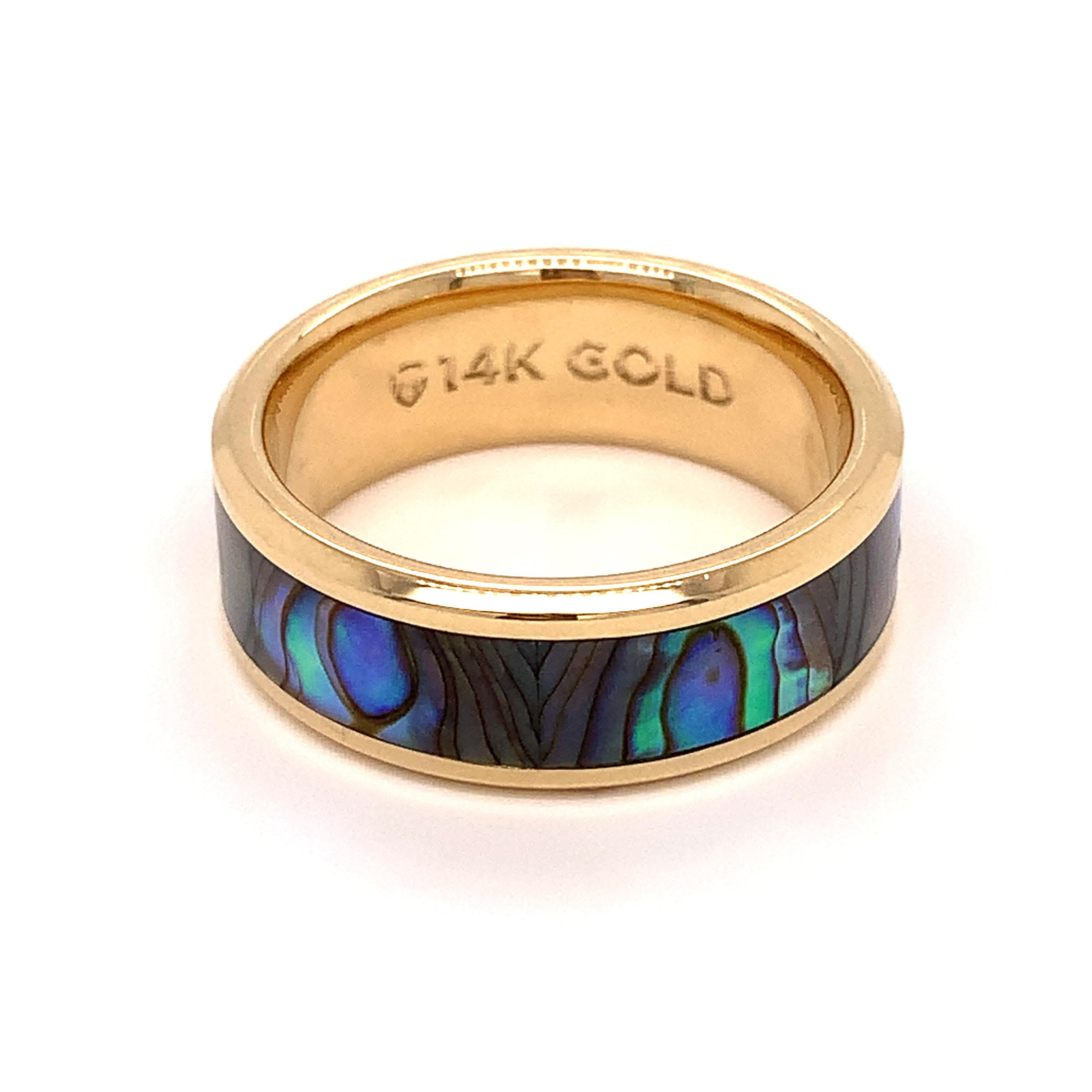 This 14K Yellow Gold men's ring by Thorsten contains a colorful Mother of Pearl inlay. This ring is a unique alternative to a traditional wedding band. The band is 8mm wide with polished edges for a more clean and finished look.

This is an estate