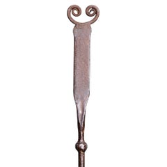 Thorton and Downer, attri. An Arts and Crafts polished steel hand wrought poker