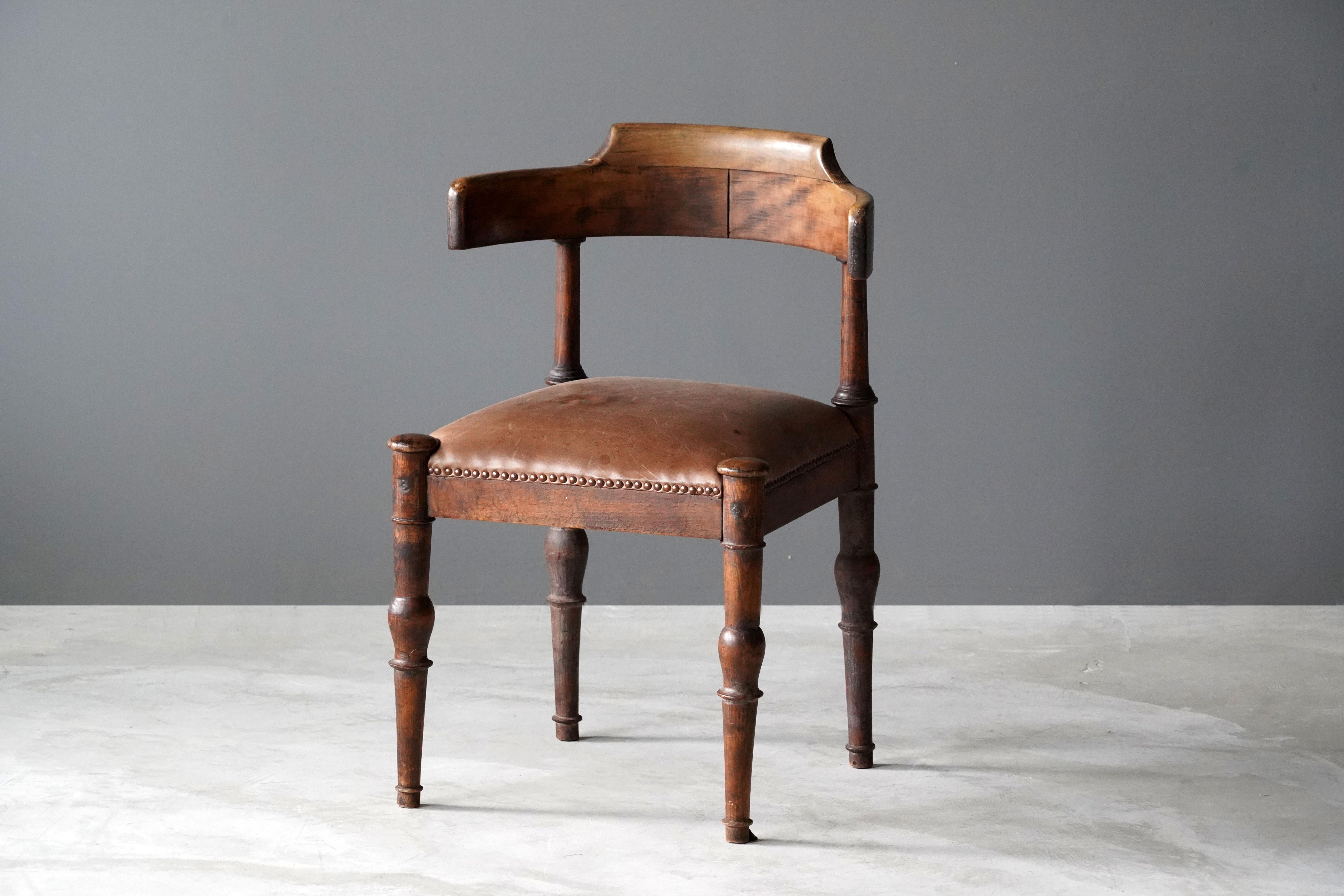 An armchair attributed to Danish architect Thorvald Bindesbøll. In finely sculpted and stained wood, leather. 

Other designers of the period include Kaare Klint, Arne Jacobsen, Axel Einar Hjorth.