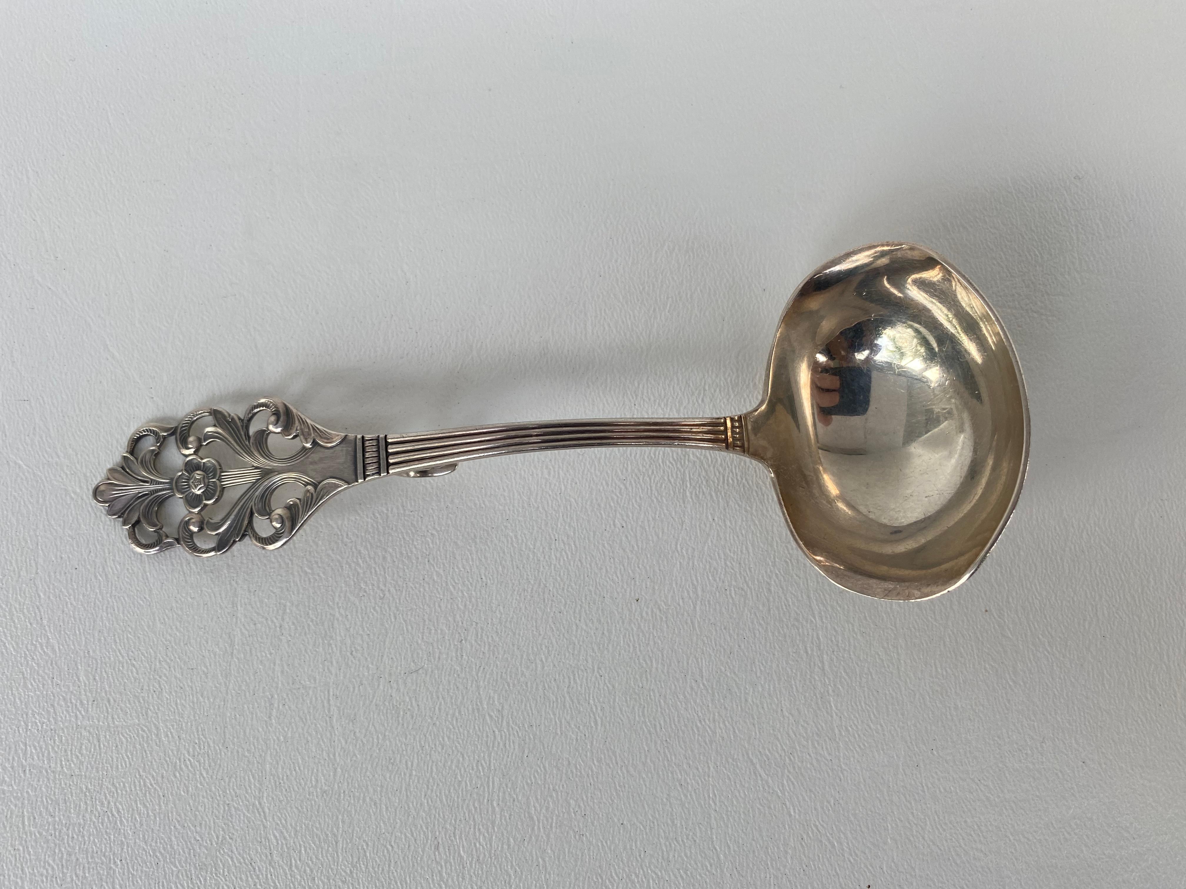 Thorvald Marthinsen viking rose sterling silver Gravy Ladle, Norway

Offered for sale is a Thorvald Marthinsen of Norway sterling silver gravy ladle in the Viking Rose pattern. This difficult-to-find serving ladle is fully marked 