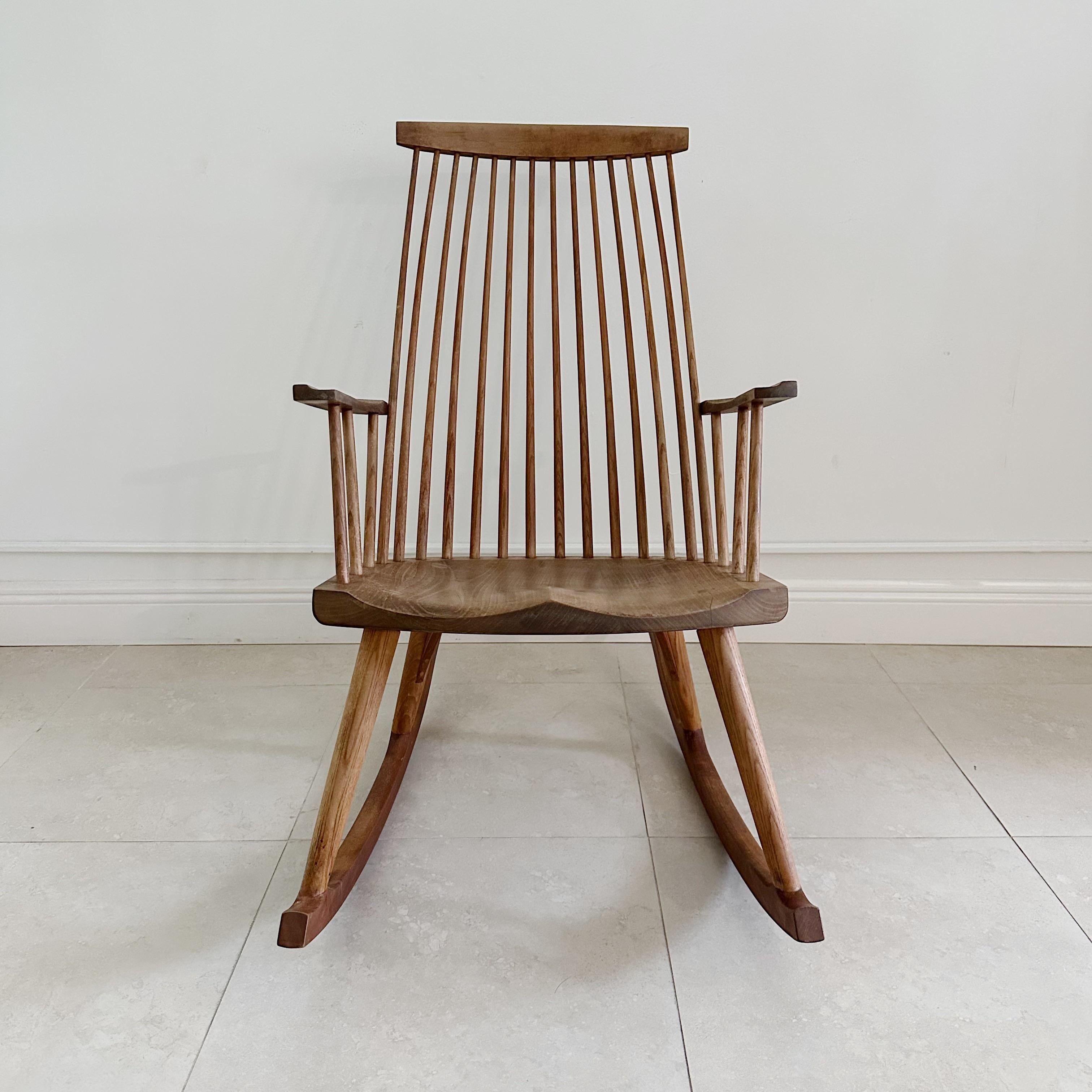 Thos Moser American Gloucester Rocker 1991

Vintage rocking chair by Thos Moser. Lightly worn with a beautiful matt patina. Signed in indelible India ink on the underside Moser Cabinetmakers, Auburn Maine, Joe Pepin 1991. Made in Thos Mosers first