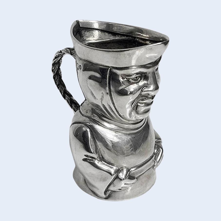 Sterling Silver Toby Cream Jug, London 1882, Thos Smiley. The Jug depicting a Toby form monk, braided handle. Height: 3 1/8 inches. Weight: 87.64 grams