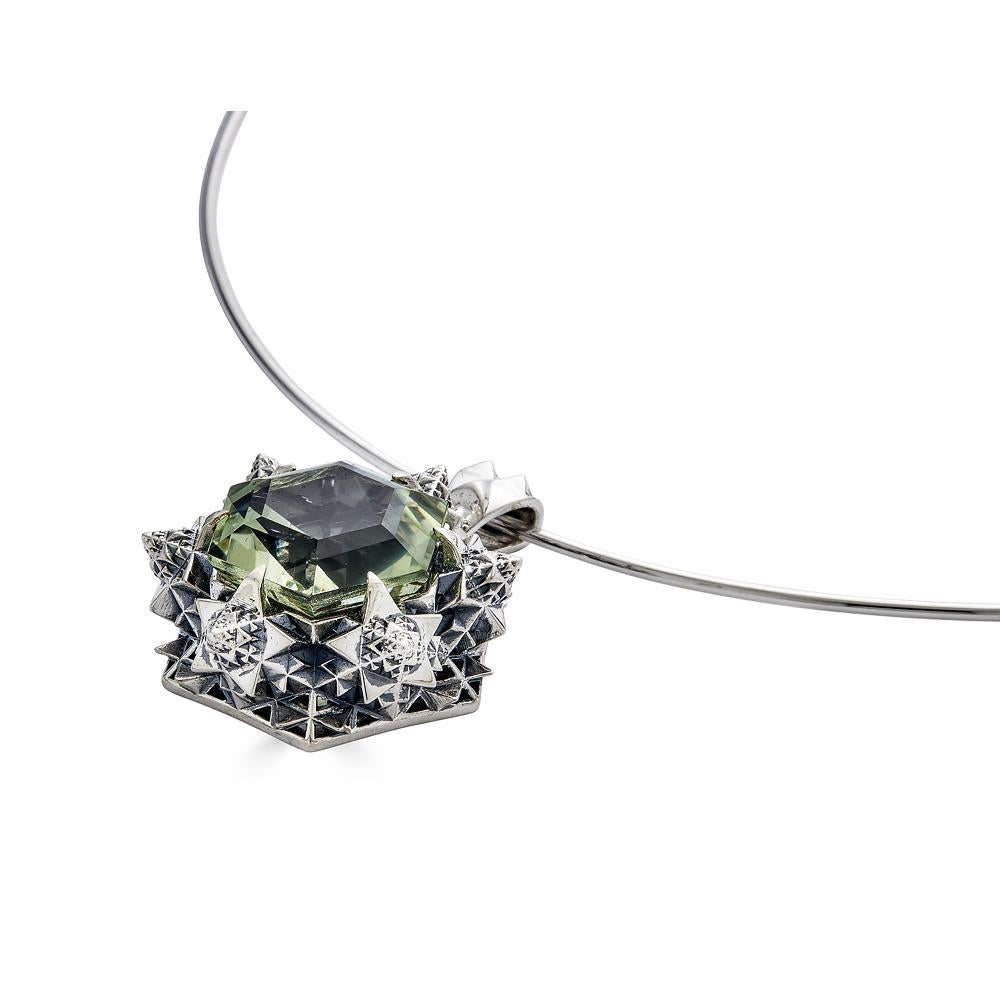 This unique pendant necklace features a hexagonal step-cut 14mm prasiolite (green amethyst) stone set in sterling silver and was designed to evoke joy in one's life. Green amethyst helps the wearer to create a profound connection to their higher