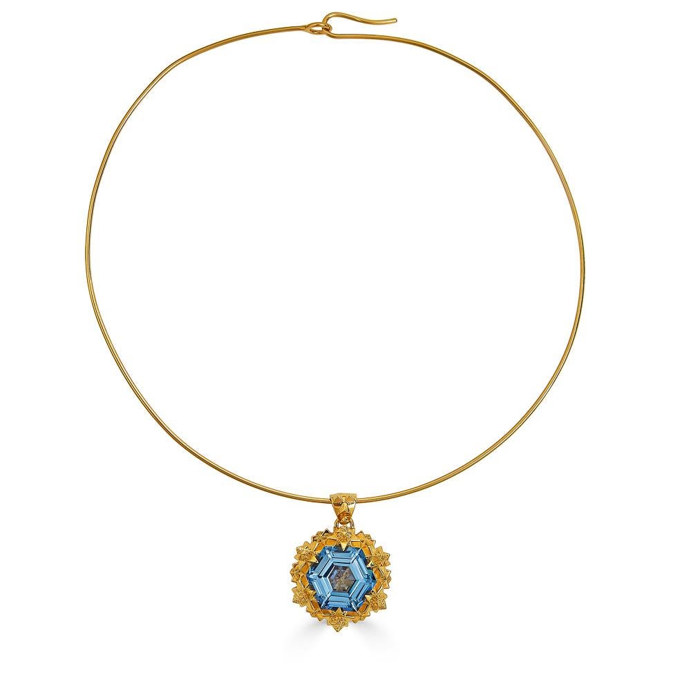 Thoscene collection pendant in gold with a 14mm hexagonal stepcut created aquamarine. Aquamarine evokes the purity of crystalline waters, and the exhilaration and relaxation of the sea. It is calming, soothing, and cleansing, and inspires truth,