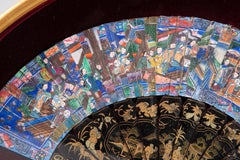 "Thousand-faced" fan in a fan case.