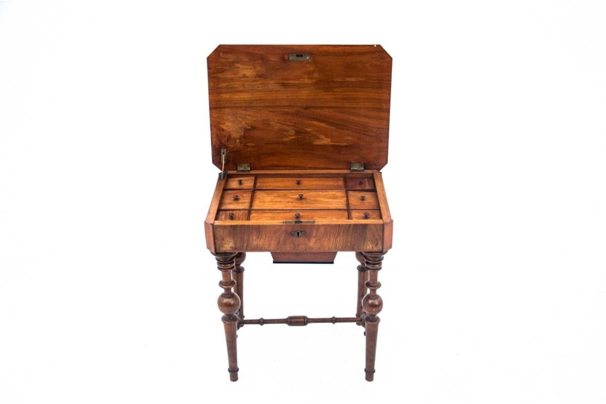 An antique table of the niciak type from the end of the 19th century in an eclectic style.

A small piece of furniture, a bit forgotten today, but once a must-have for a housewife for needlework. The table has a hinged top with many compartments,