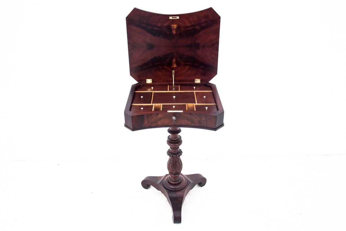 A thread table from the second half of the 19th century in the Biedermeier style.

A small piece of furniture, a bit forgotten today, but once a must-have for a housewife for needlework. The table has a tiltable top with many compartments, all