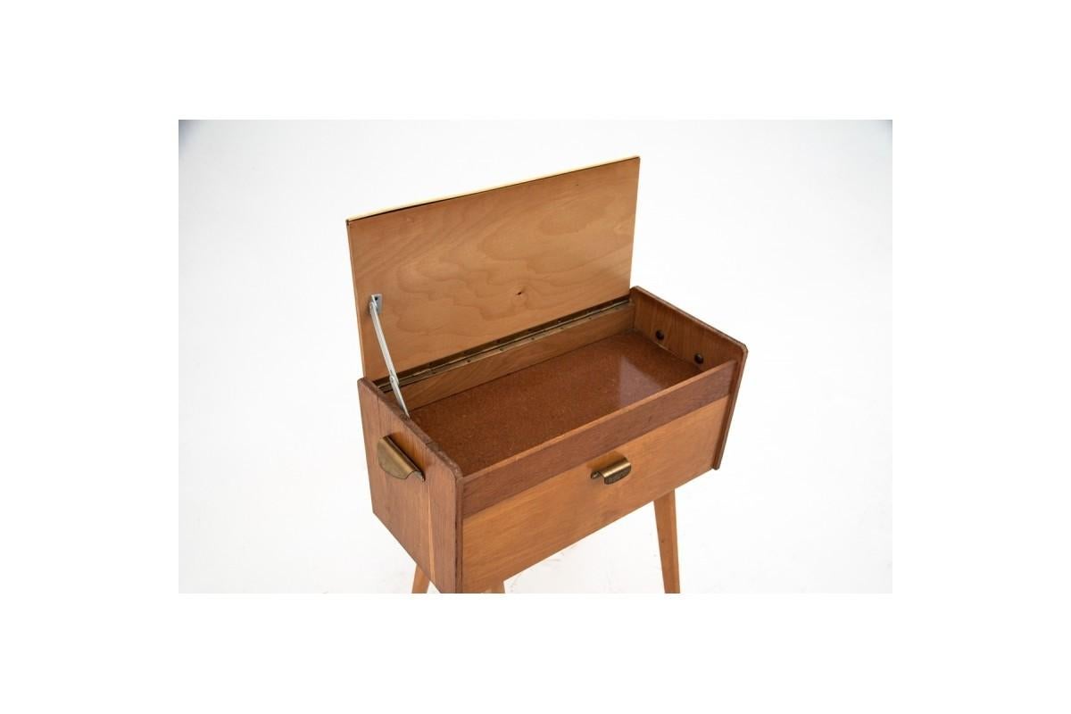 Thread table, Poland, 70s.

A small, minimalist table with drawers and compartments. Originally used as a sewing table, it even has a stand for spools of thread, today it can be used for its original purpose or for storing small items and as a small