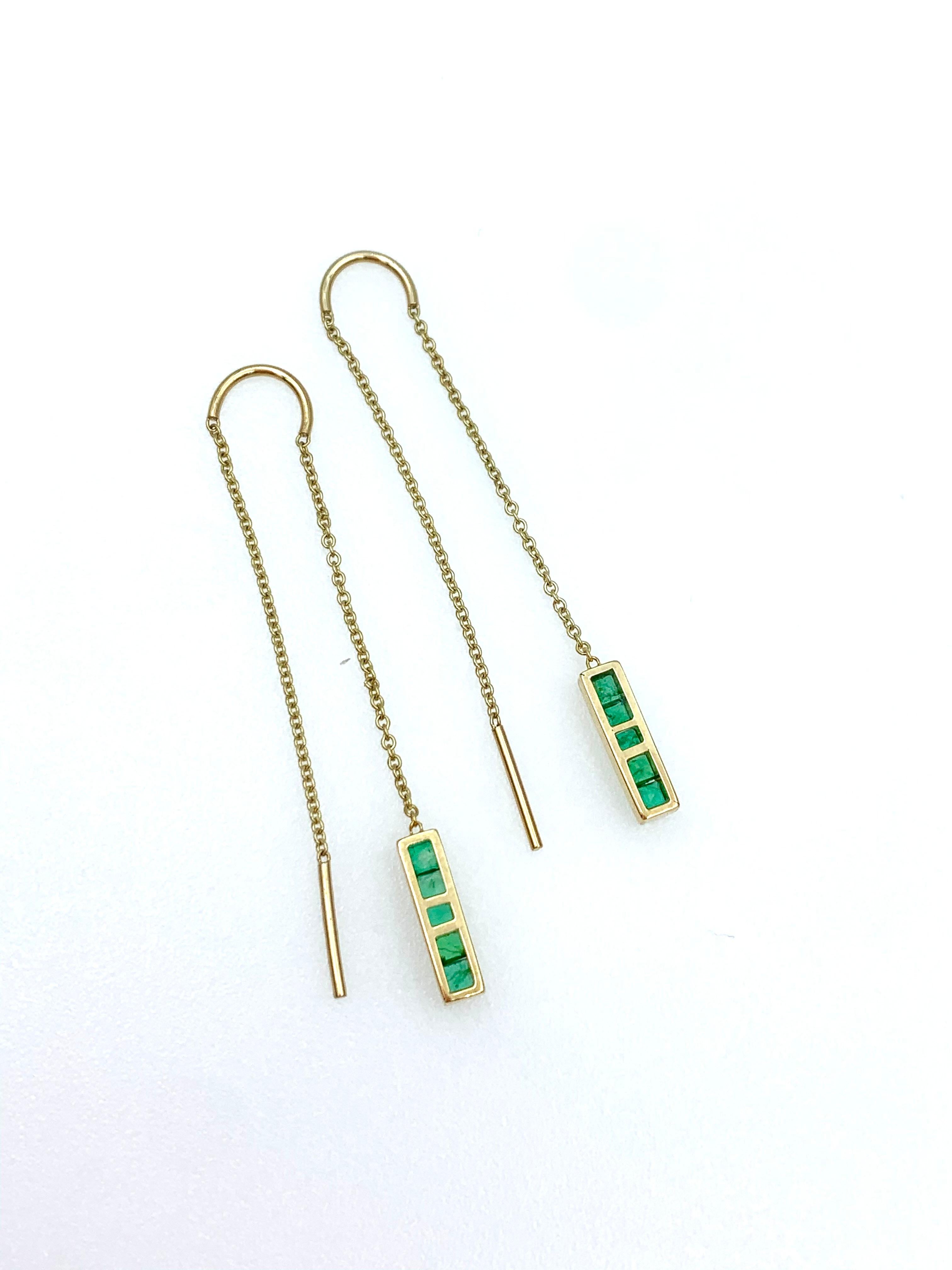 Hand made in 9 karat yellow gold and five channel set Emeralds on each Earring, these light weight thread through earrings are ideal for a day to night transition, they look just as chic in casual attire as they do in a more elegant setting. Part of