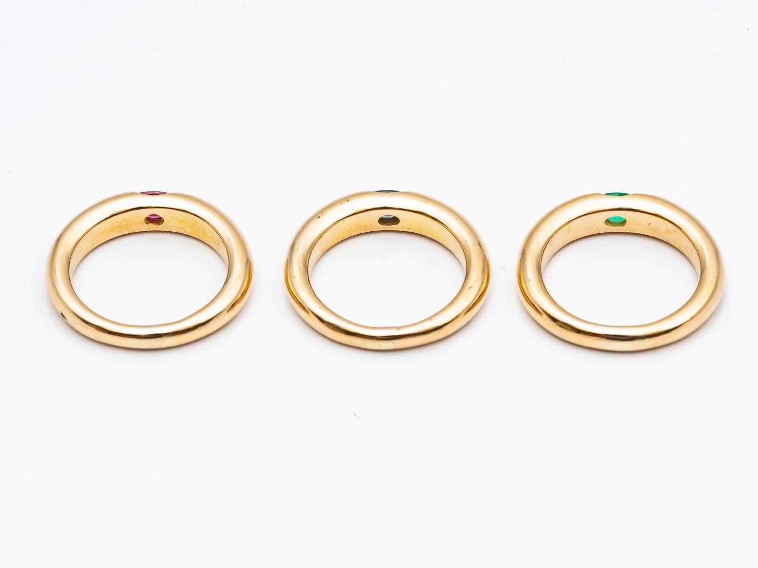 Three 18 Karat Gold Bangles Rings Set with an Emerald, a Sapphire, and a Ruby 5