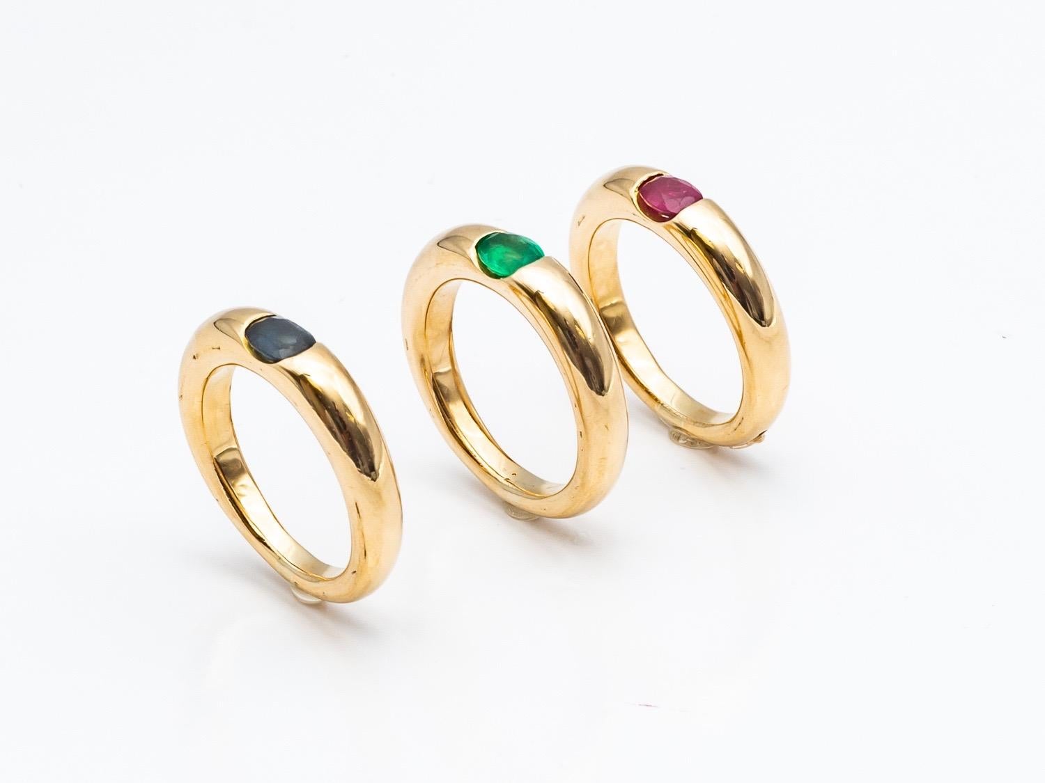 Three 18 Karat Gold Bangles Rings Set with an Emerald, a Sapphire, and a Ruby 6