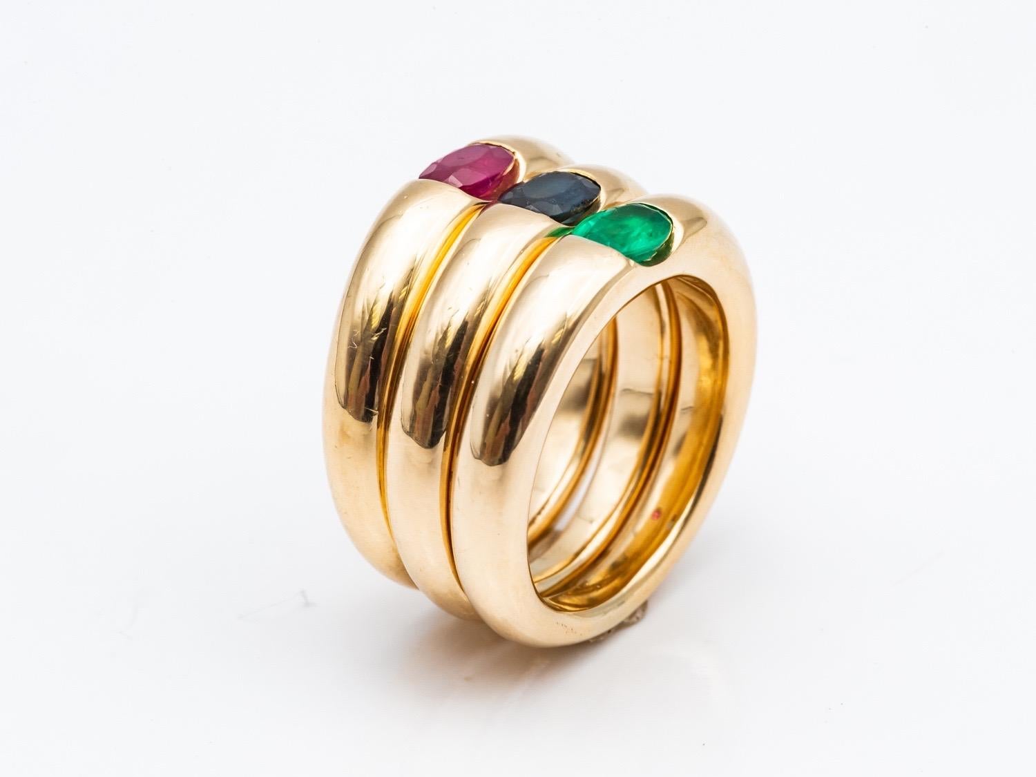 Three 18 Karat Gold Bangles Rings Set with an Emerald, a Sapphire, and a Ruby 7