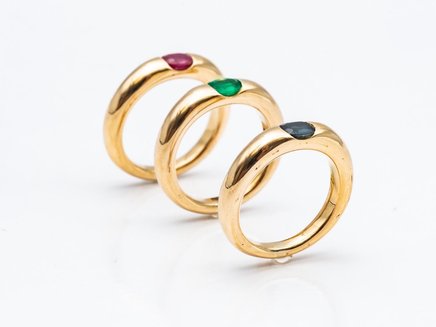 Three 18 Karat Gold Bangles Rings Set with an Emerald, a Sapphire, and a Ruby 8