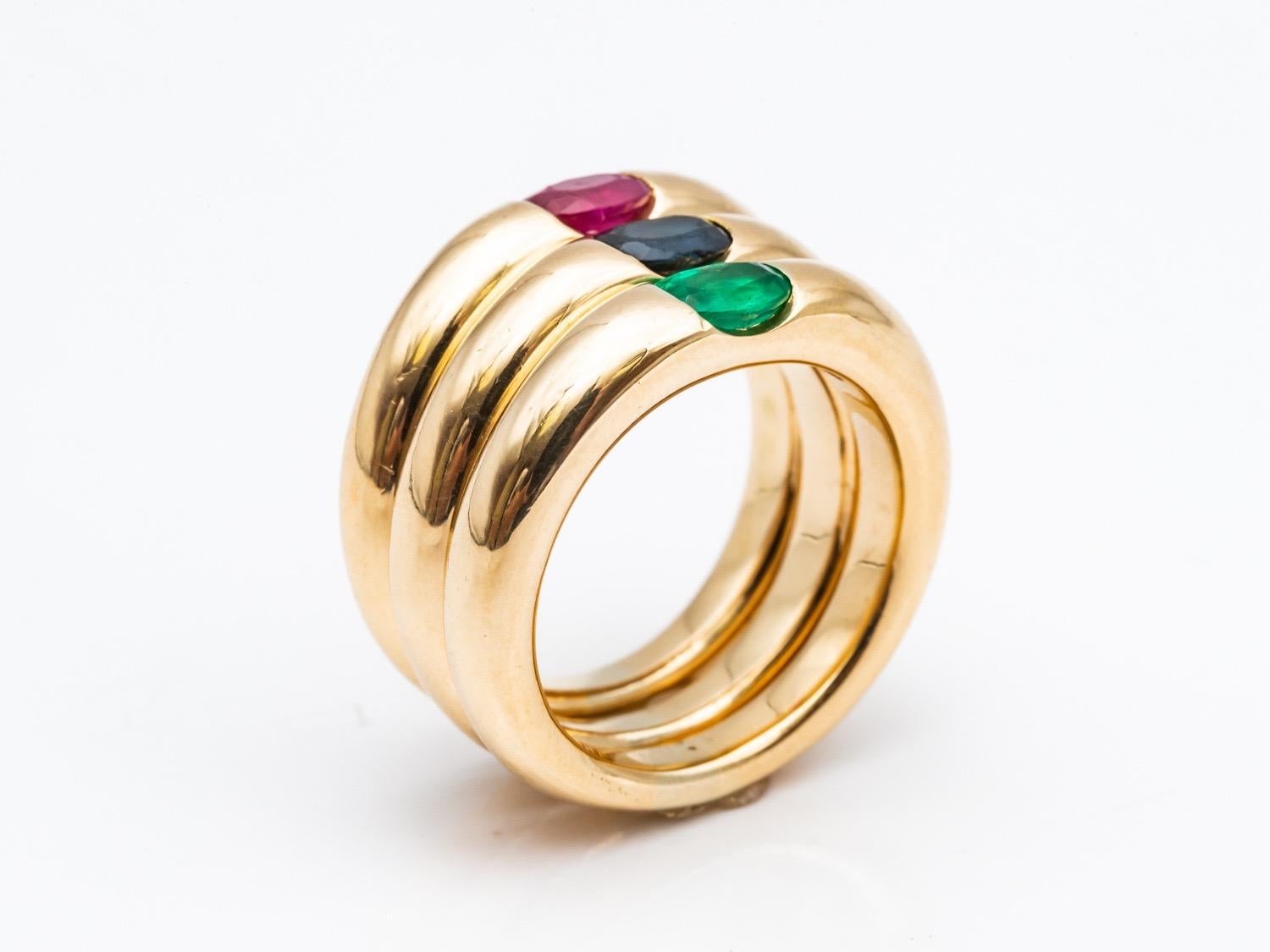 Three 18 Karat Gold Bangles Rings Set with an Emerald, a Sapphire, and a Ruby 9