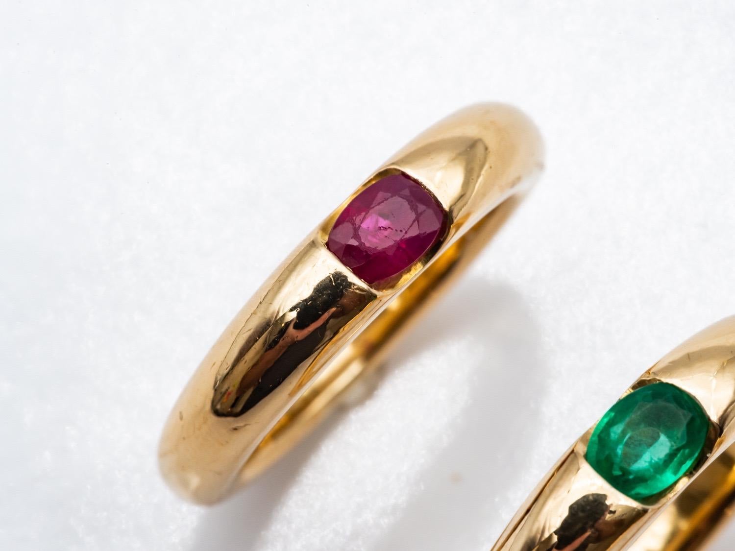 Women's or Men's Three 18 Karat Gold Bangles Rings Set with an Emerald, a Sapphire, and a Ruby