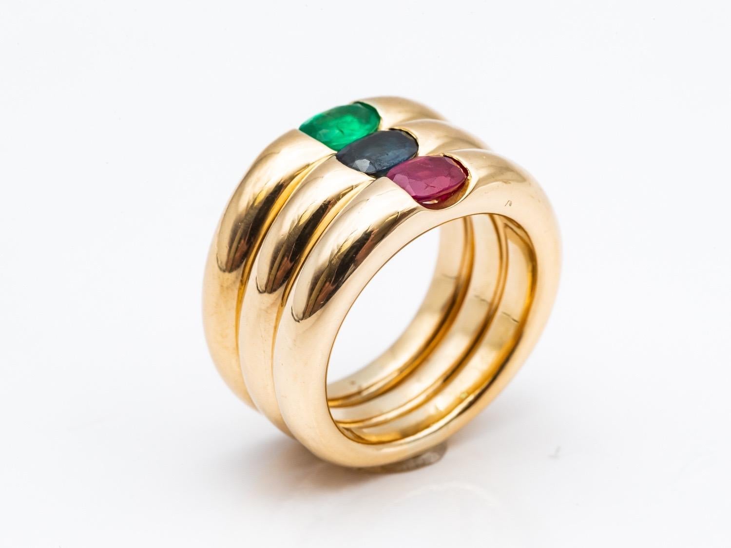 Three 18 Karat Gold Bangles Rings Set with an Emerald, a Sapphire, and a Ruby 1