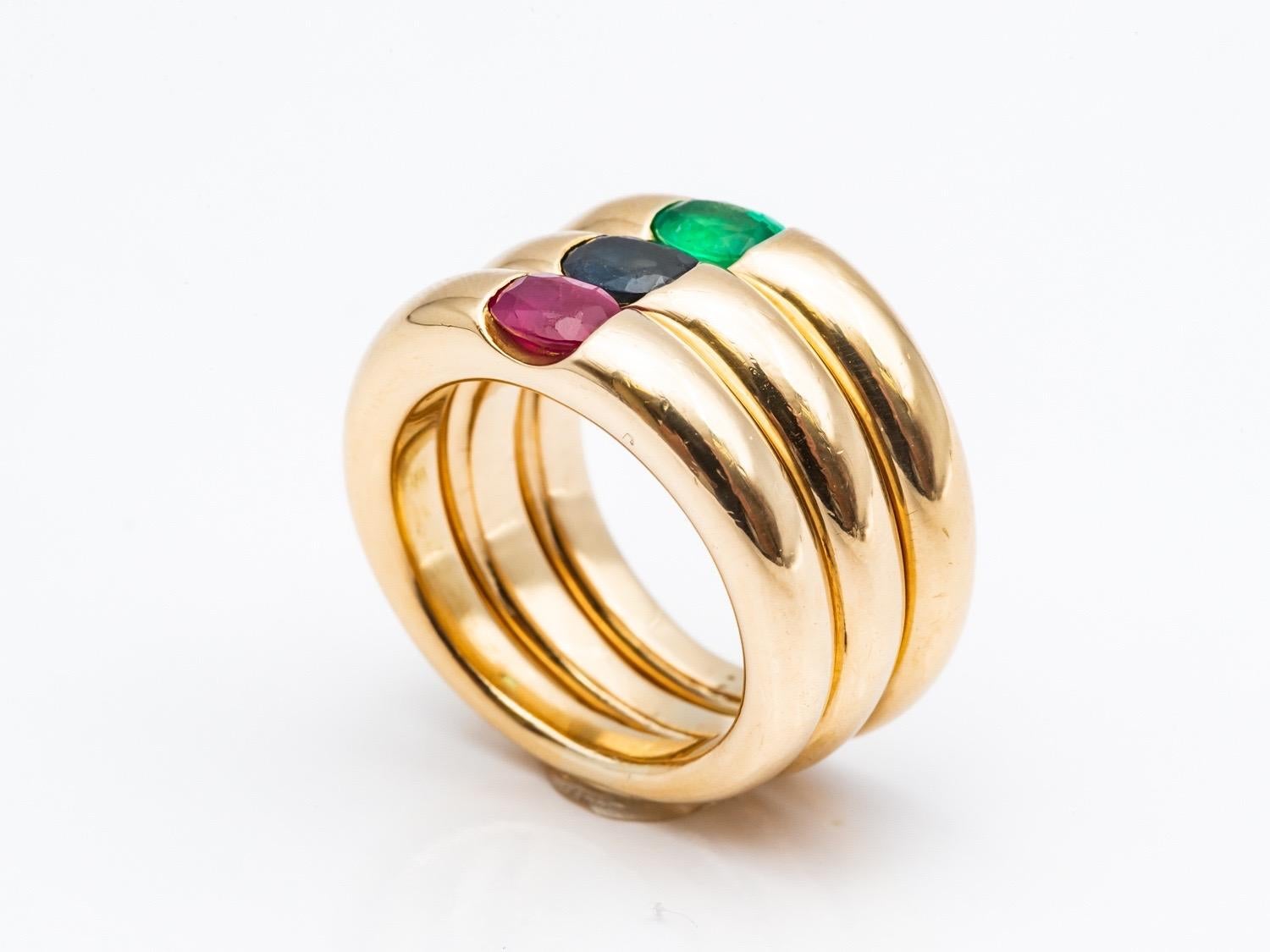 Three 18 Karat Gold Bangles Rings Set with an Emerald, a Sapphire, and a Ruby 2