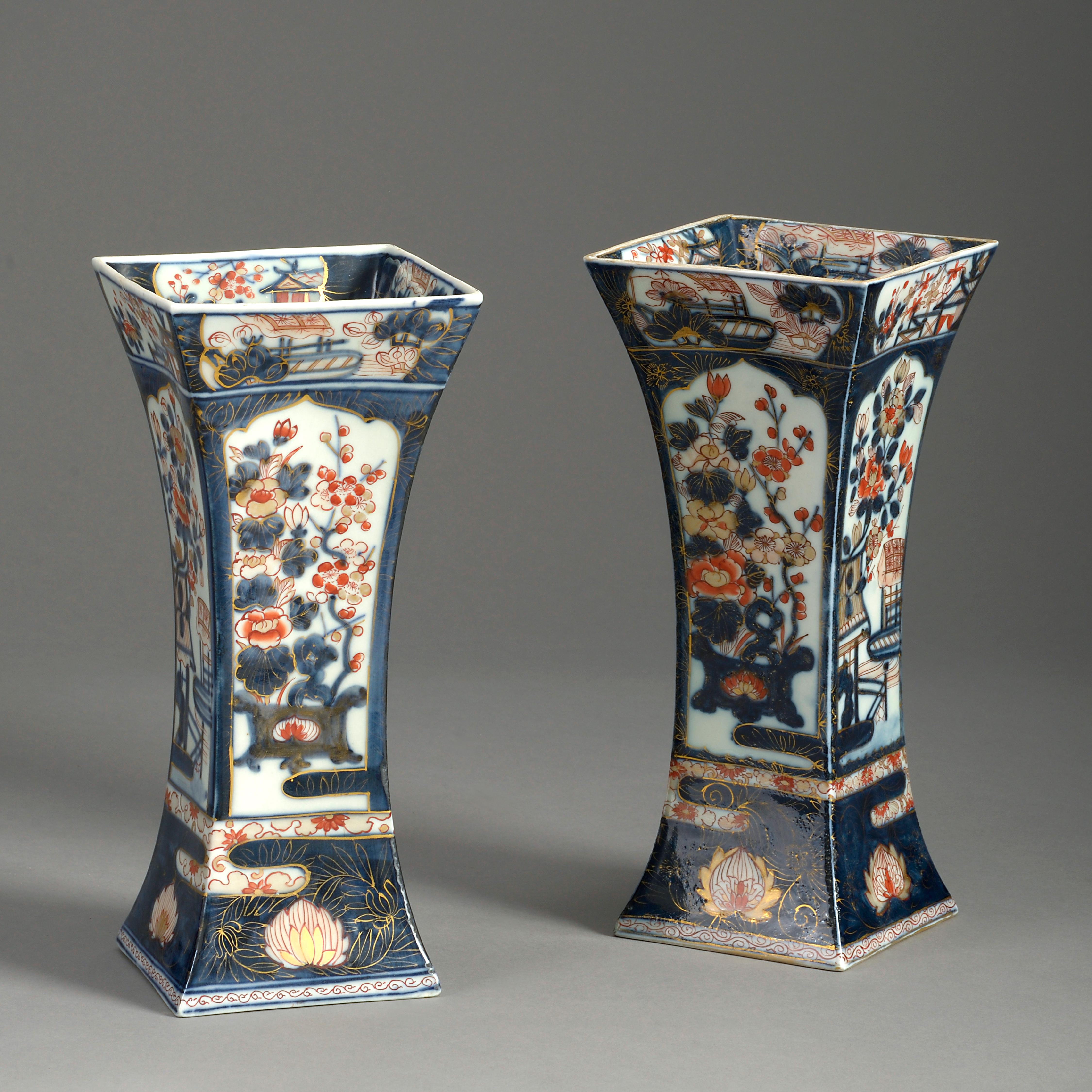 A nineteenth century matched garniture of three Samson Imari porcelain vases, including a baluster vase with cover, together with a pair of square trumpet form vases, all decorated in the traditional manner.

Dimensions listed refer to the single