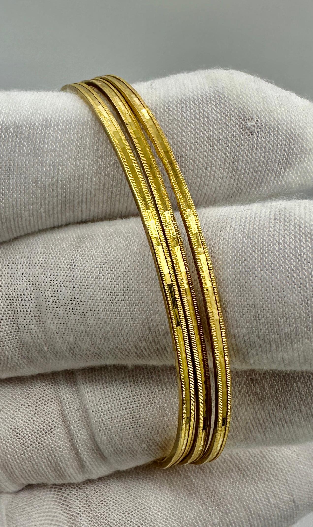 Contemporary Three 22 Karat Gold Bangle Stacking Bracelets 26.6 Grams Yellow Gold For Sale