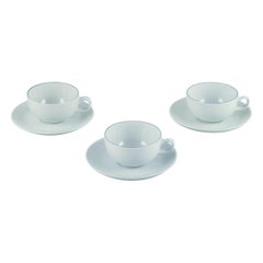 Three Aluminia/Royal Copenhagen blue line coffee cups and saucers.