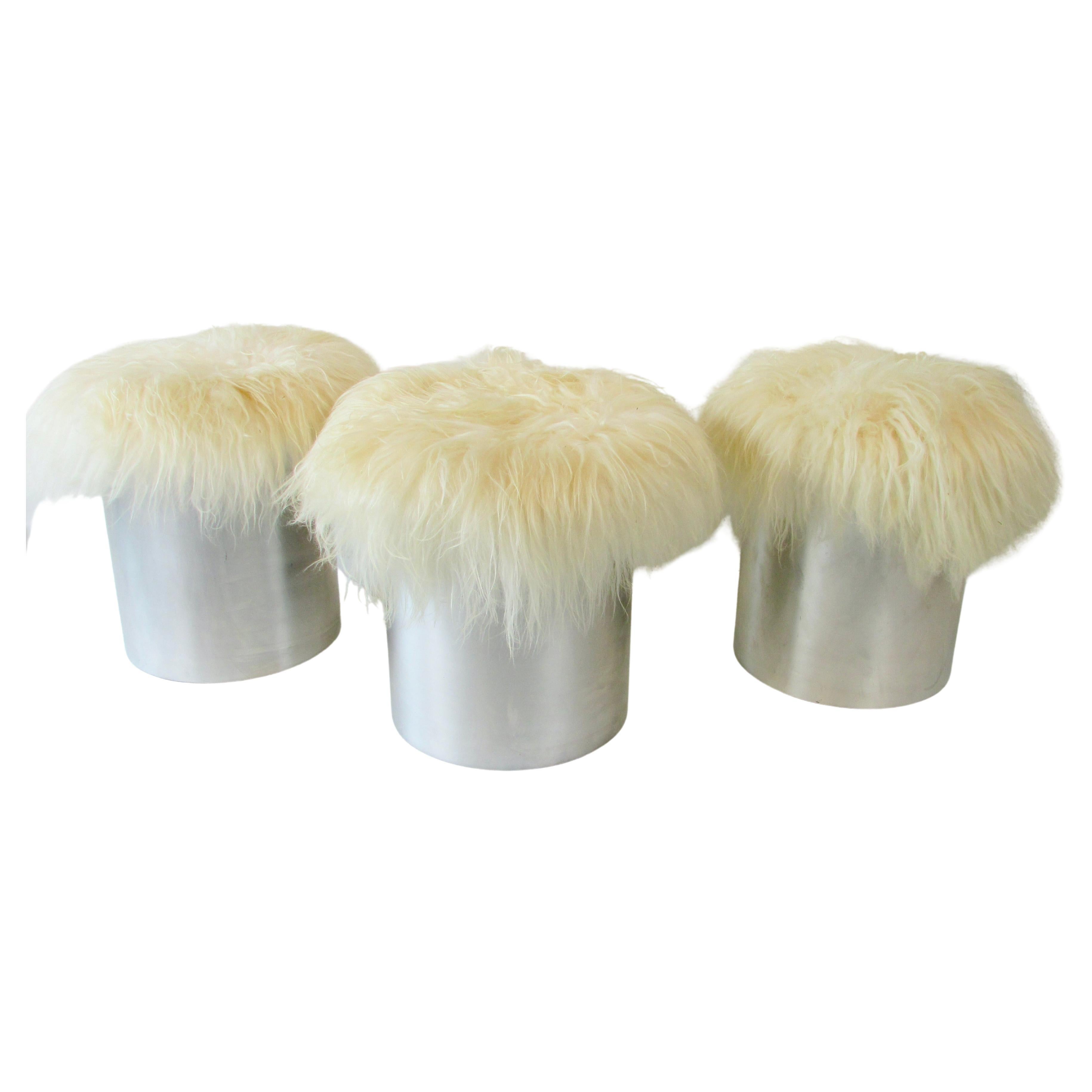 Mid-Century Modern Three Aluminum cylinder base Mongolian curly Lamb hide poufs or stools