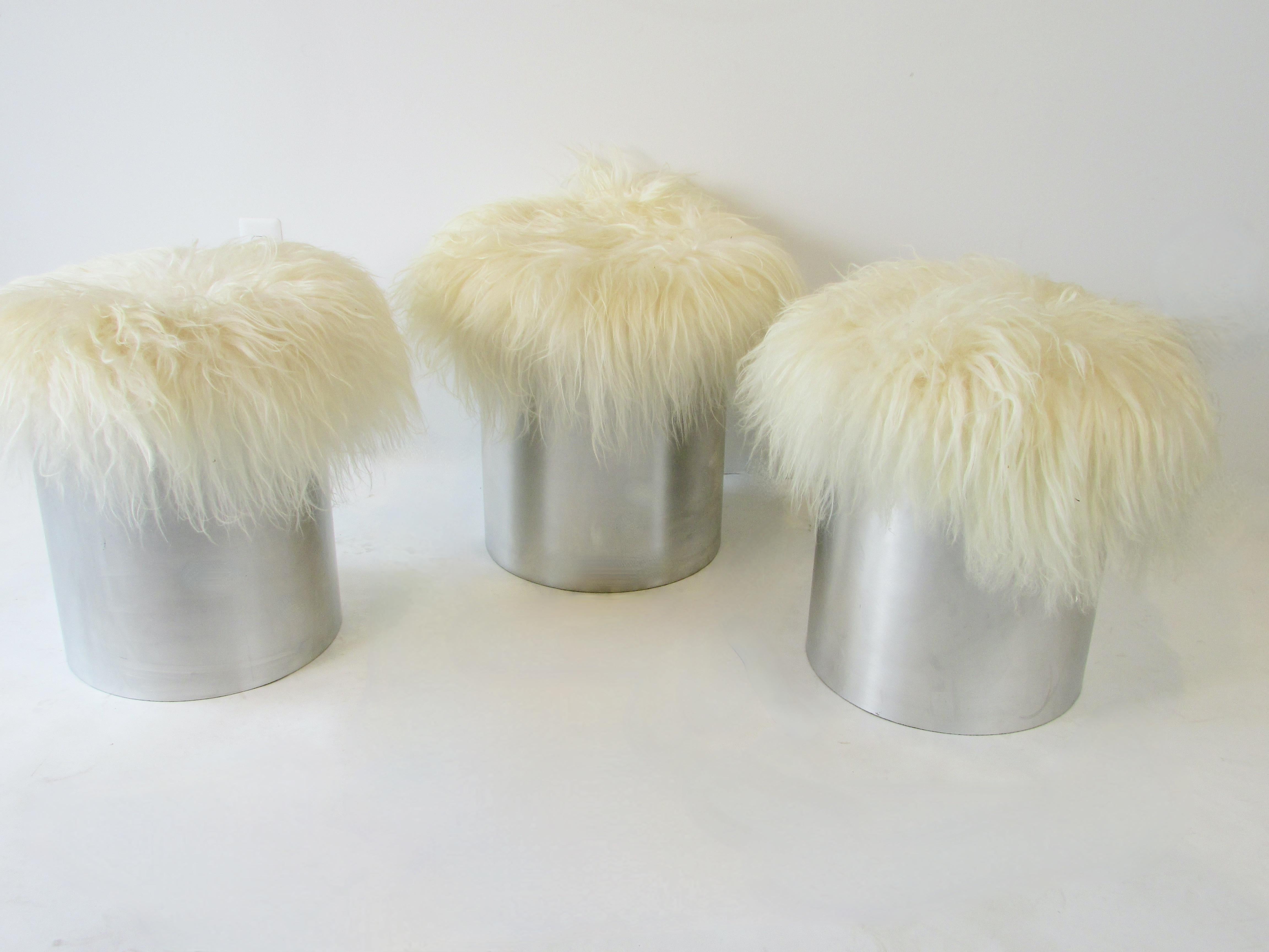 Three Aluminum cylinder base Mongolian curly Lamb hide poufs or stools In Good Condition In Ferndale, MI