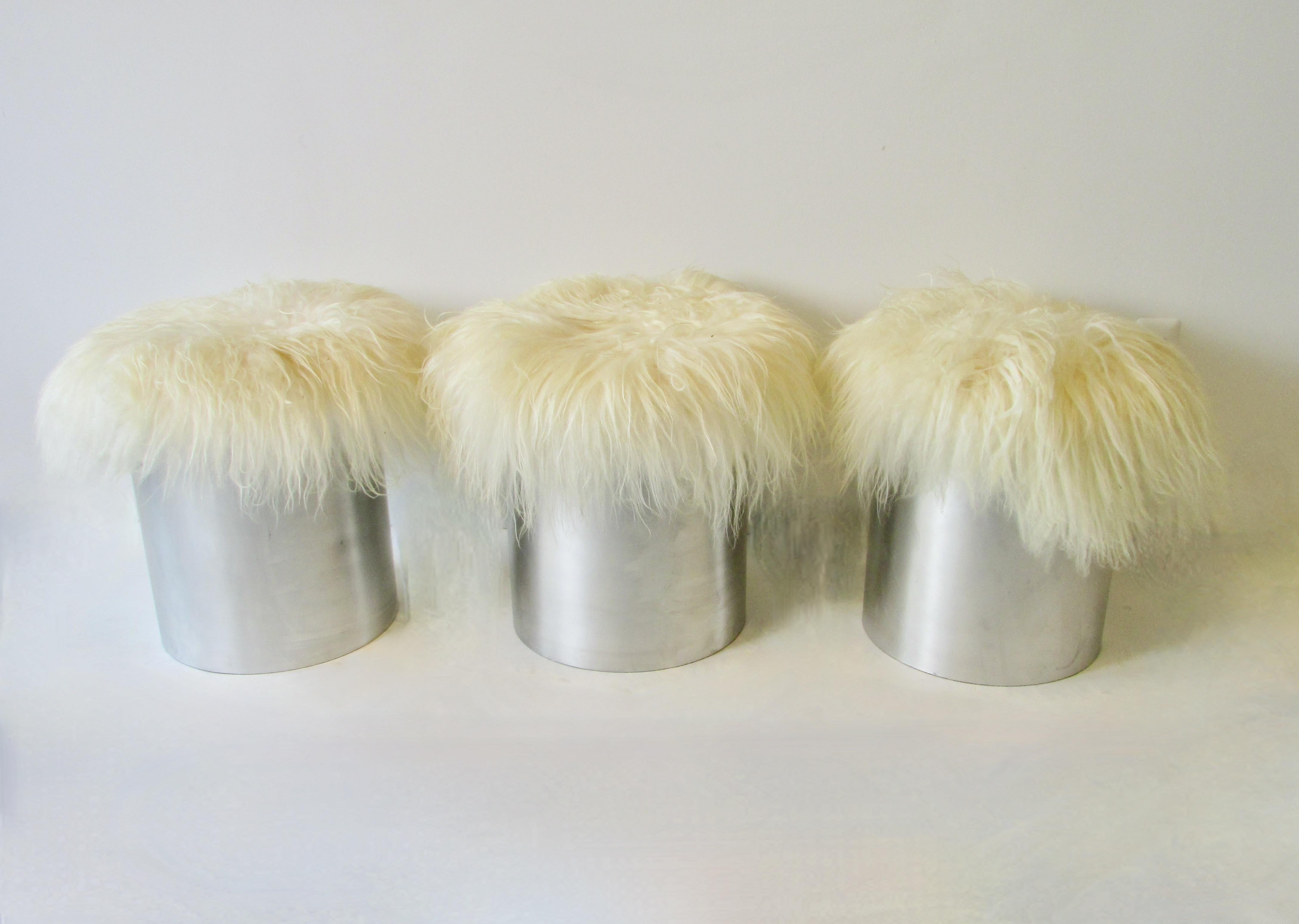 20th Century Three Aluminum cylinder base Mongolian curly Lamb hide poufs or stools