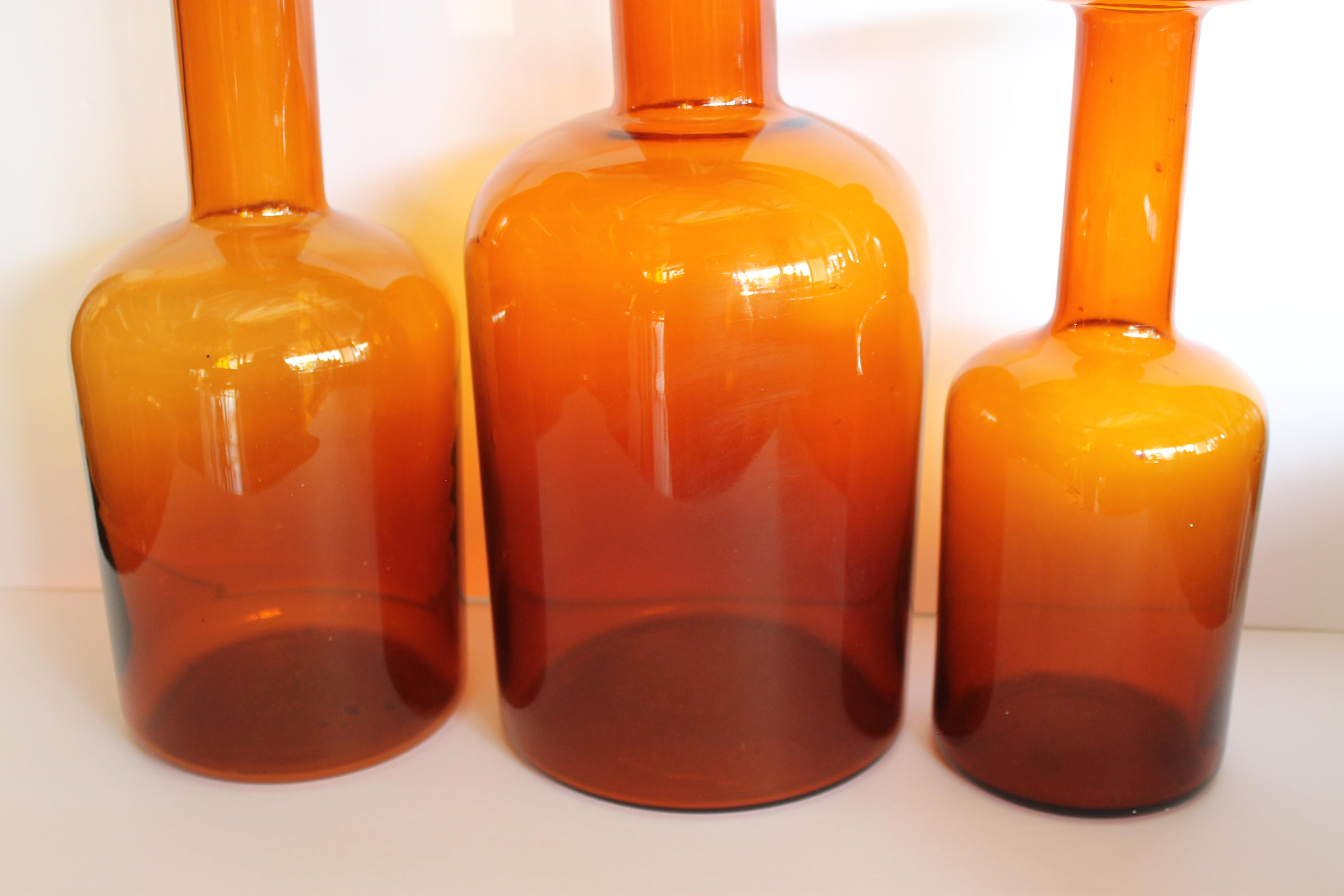 Three amber bottles by Otto Bauer for Holmegaard. Measures: Large bottle measures 17.5