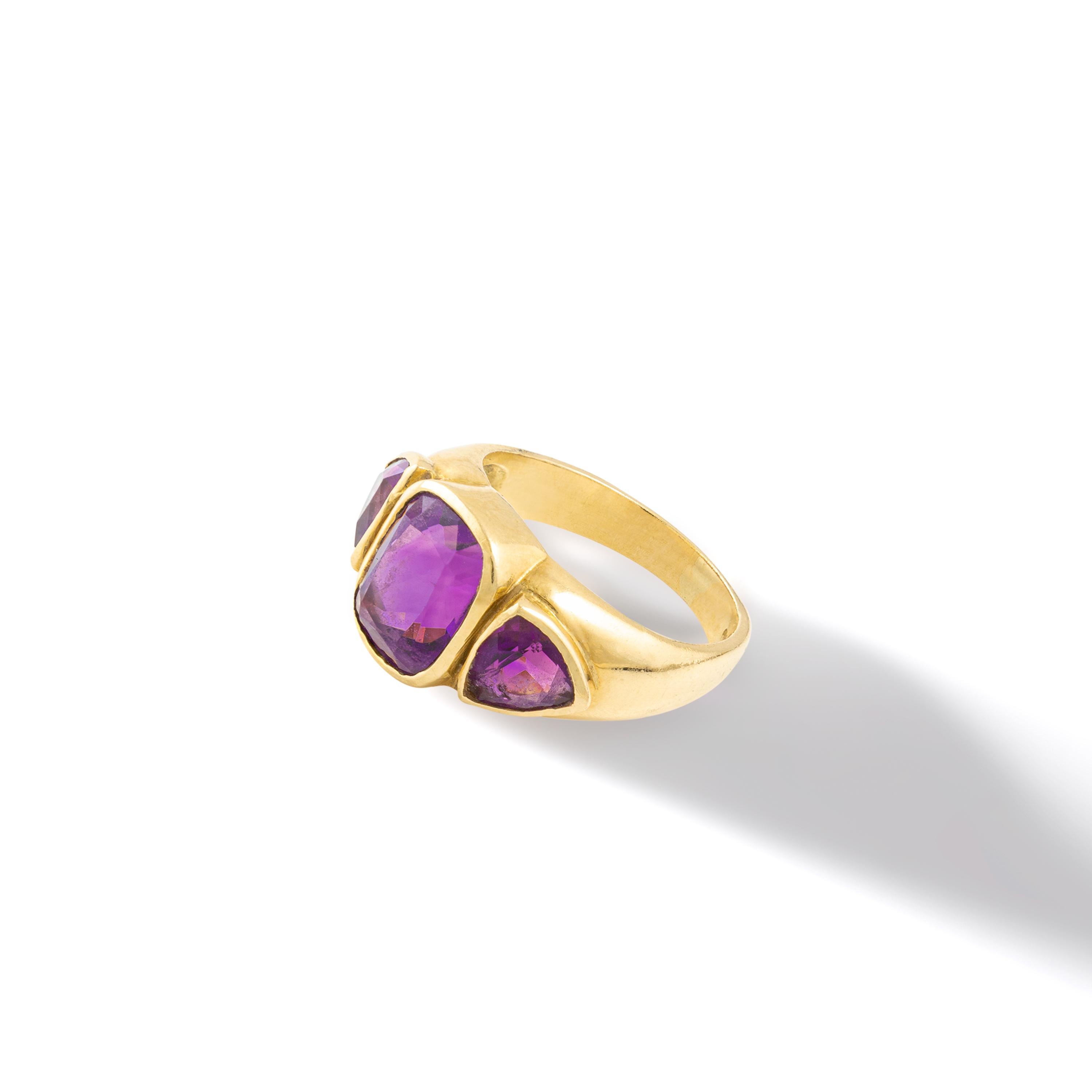 Three Amethysts on Yellow Gold 18k Ring.
Italian work.

Ring size: 5 3/4.