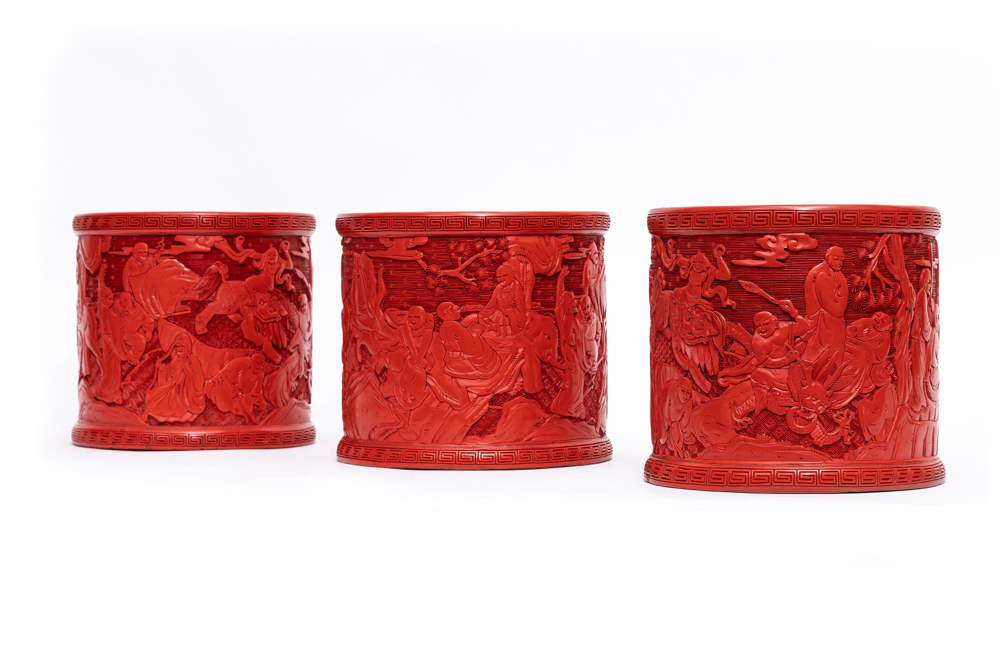A Magnificent Set of Three Antique Chinese Cinnabar Lacquer Vases/cashepots/flower pots; with Gorgeous Chinese Carved Decoration.  This set of three lacquer brush pots feature intricate relief carving on a rich crimson frieze. Each vase is shaped