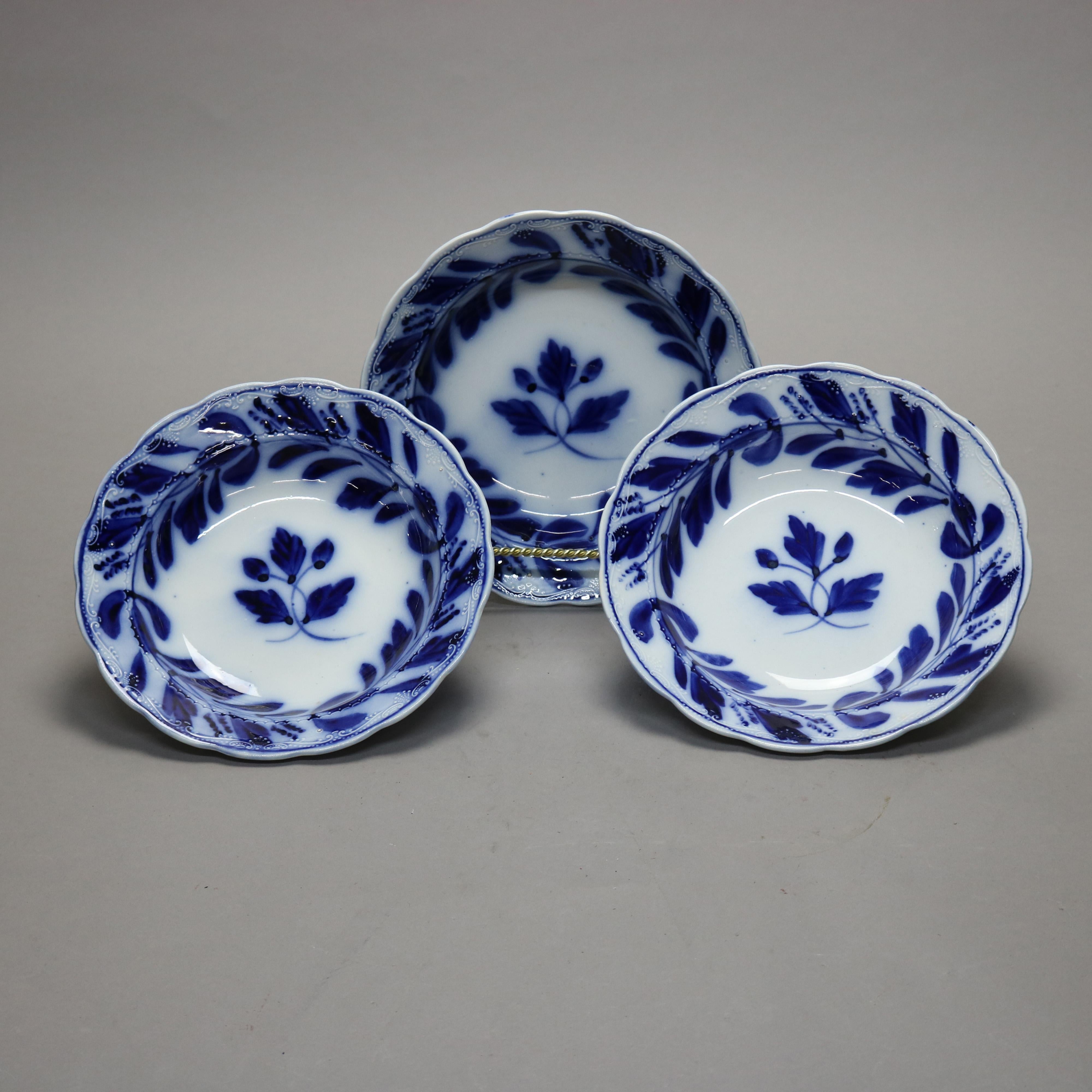 A set of three antique English Davenport bowls offer porcelain construction with well and rim having flow blue foliate decoration and scalloped rims, marked on bases as photographed, c1850.

Measures - 2''H x 9.5''W x 9.5''D.