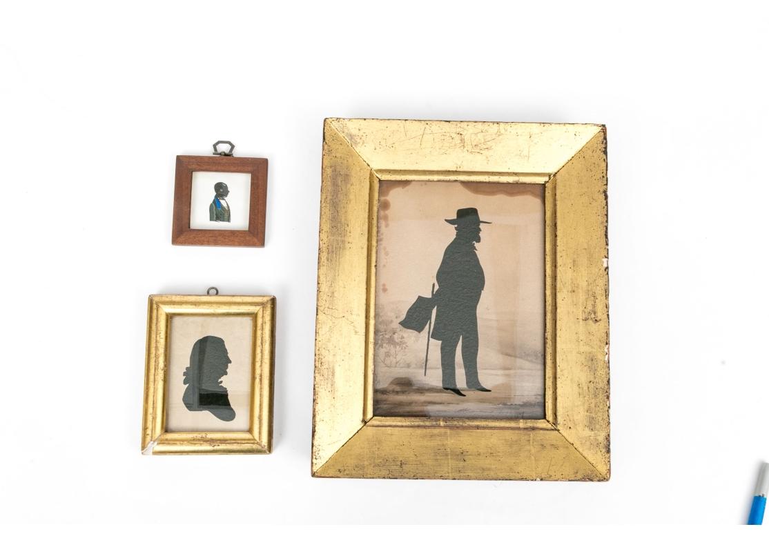 Comprised of a larger on panel, marked as being by American artist, William Henry Brown (American, 1808 - 1883). 
Together with two smaller silhouettes. 
All framed and glazed. 

Condition: Wear including staining to the largest in the upper corners