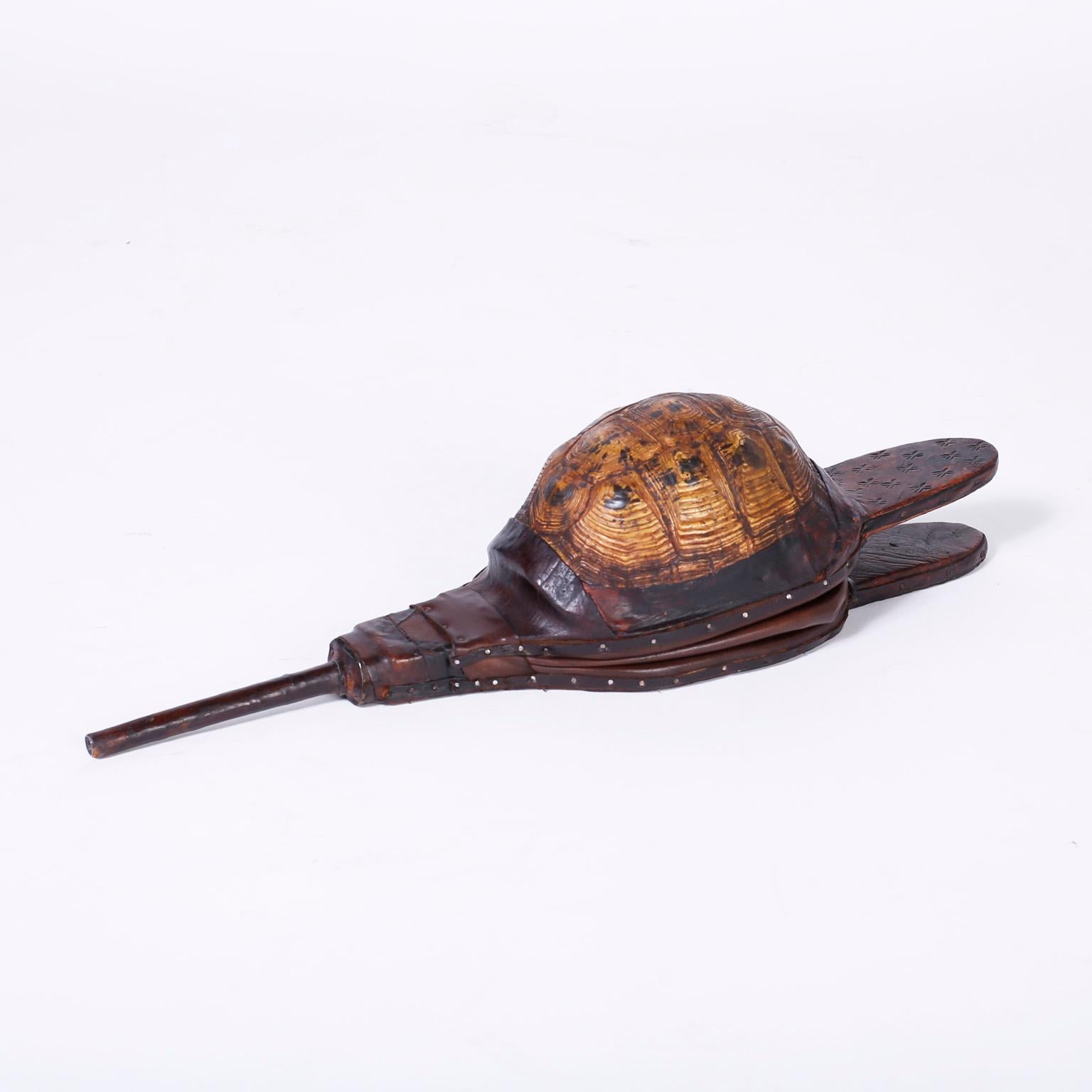 Here is an unusual and rare trio of functioning antique bellows crafted in wood leather and turtle shells with a rustic form and beautiful aged patina. No household is complete without them. Priced individually. 

Measures: Larger tortoiseshell H