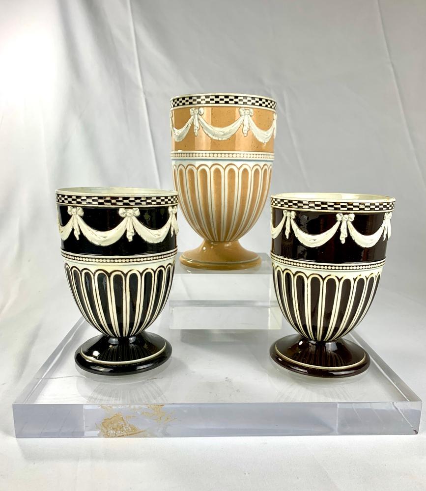 These three Wedgwood pearlware* vases were made around 1790 at the Wedgwood factory in Burslem Staffordshire, England. 
They were sprigged with 