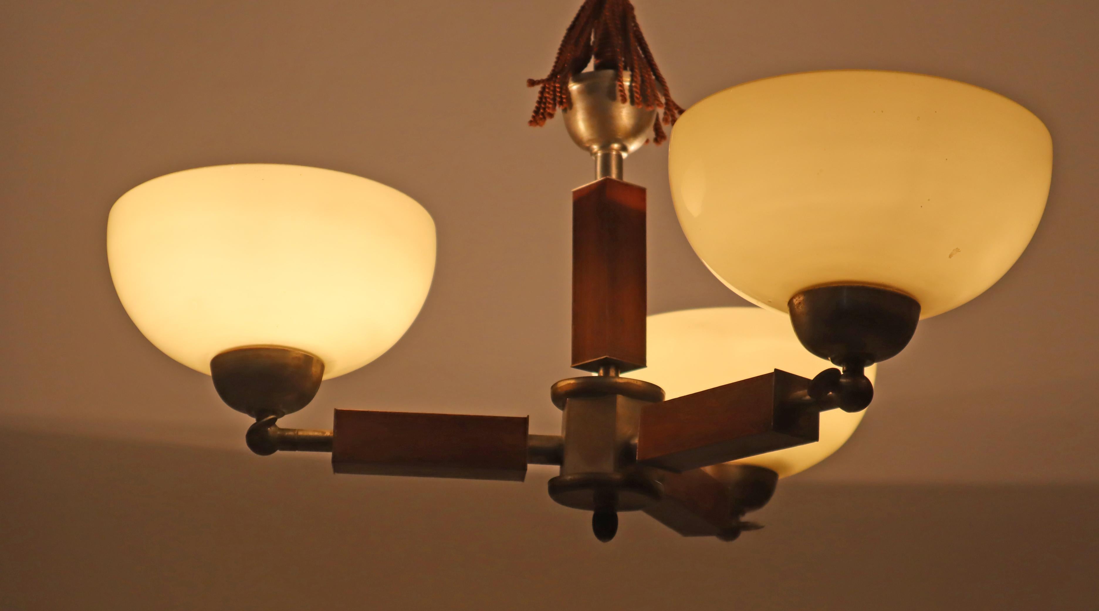 Glass Three arm Art-deco chandelier made out of glass wood and chrome.  Germany 1930s For Sale