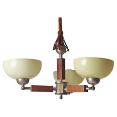 Three arm Art-deco chandelier made out of glass wood and chrome.  Germany 1930s