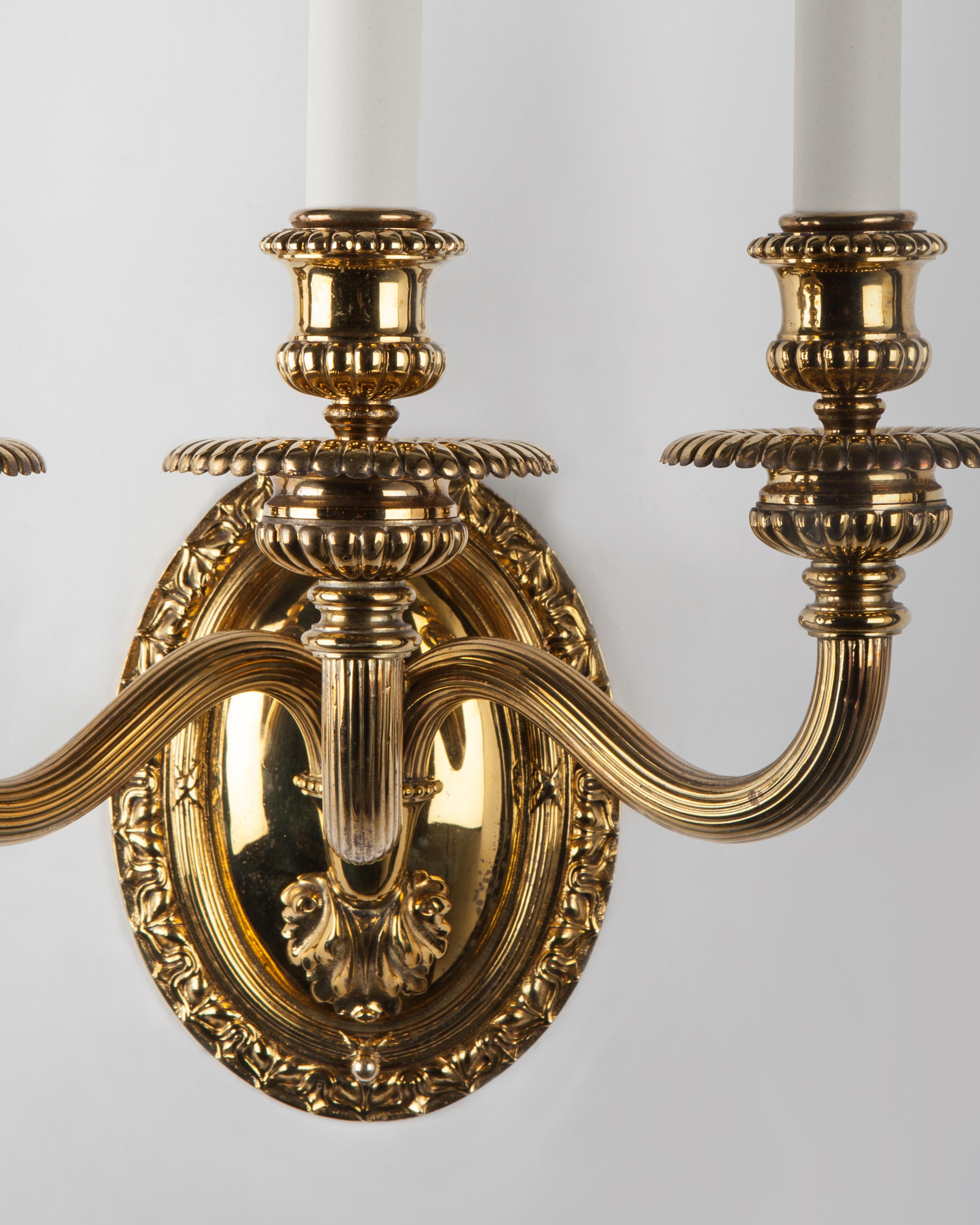 Georgian Three Arm Brass Sconces Signed by the Edward F. Caldwell Co. Circa 1910s For Sale