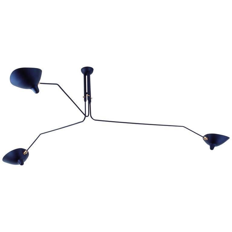 Simple and elegant, this ceiling lamp makes a dramatic addition to a variety of room settings. With 3 rotating arms of differing lengths and heads that revolve and tilt, this lamp is capable of projecting upwards, downwards and