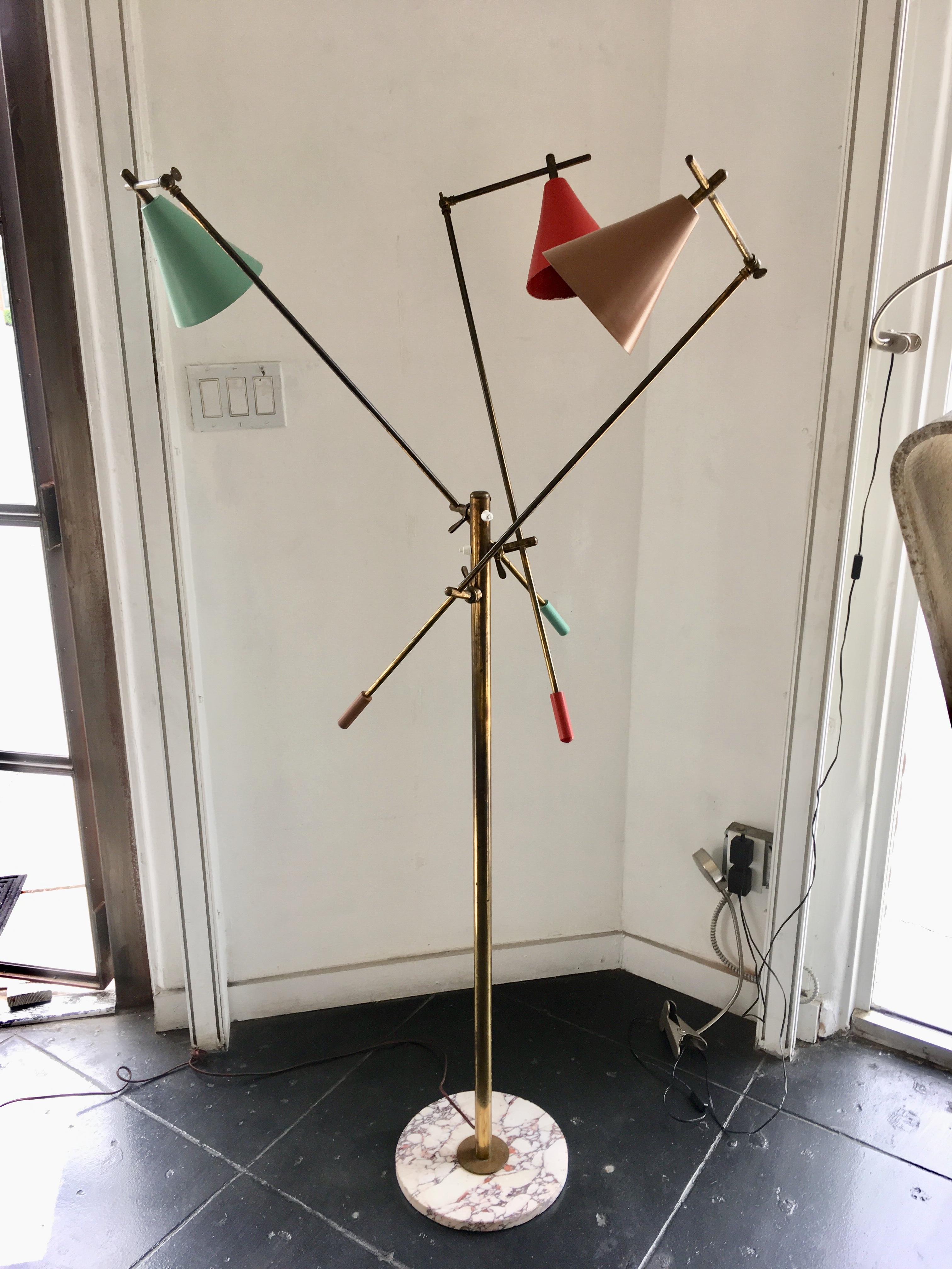 Very rare three-arm floor lamp by Stilnovo. Manufactured in Italy, circa 1950s. Brass hardware, original enameled aluminum shades, marble base. Arms and shades adjust to various positions. Rewired for US sockets. Takes three E27 40w maximum bulbs.