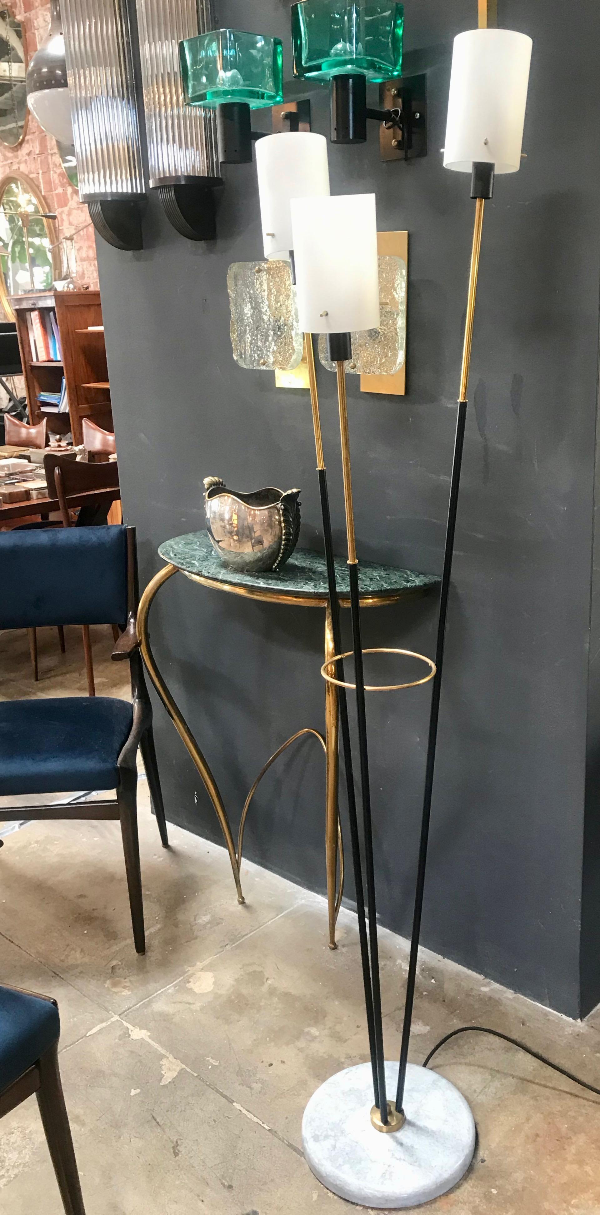 Three-arm floor lamp in brass and metal with opaline prisms and marble base, Italy 1950s.
The diameter of the opaline prism is 3.8 in.
The lamp is in good vintage condition and there is patina on the brass parts.