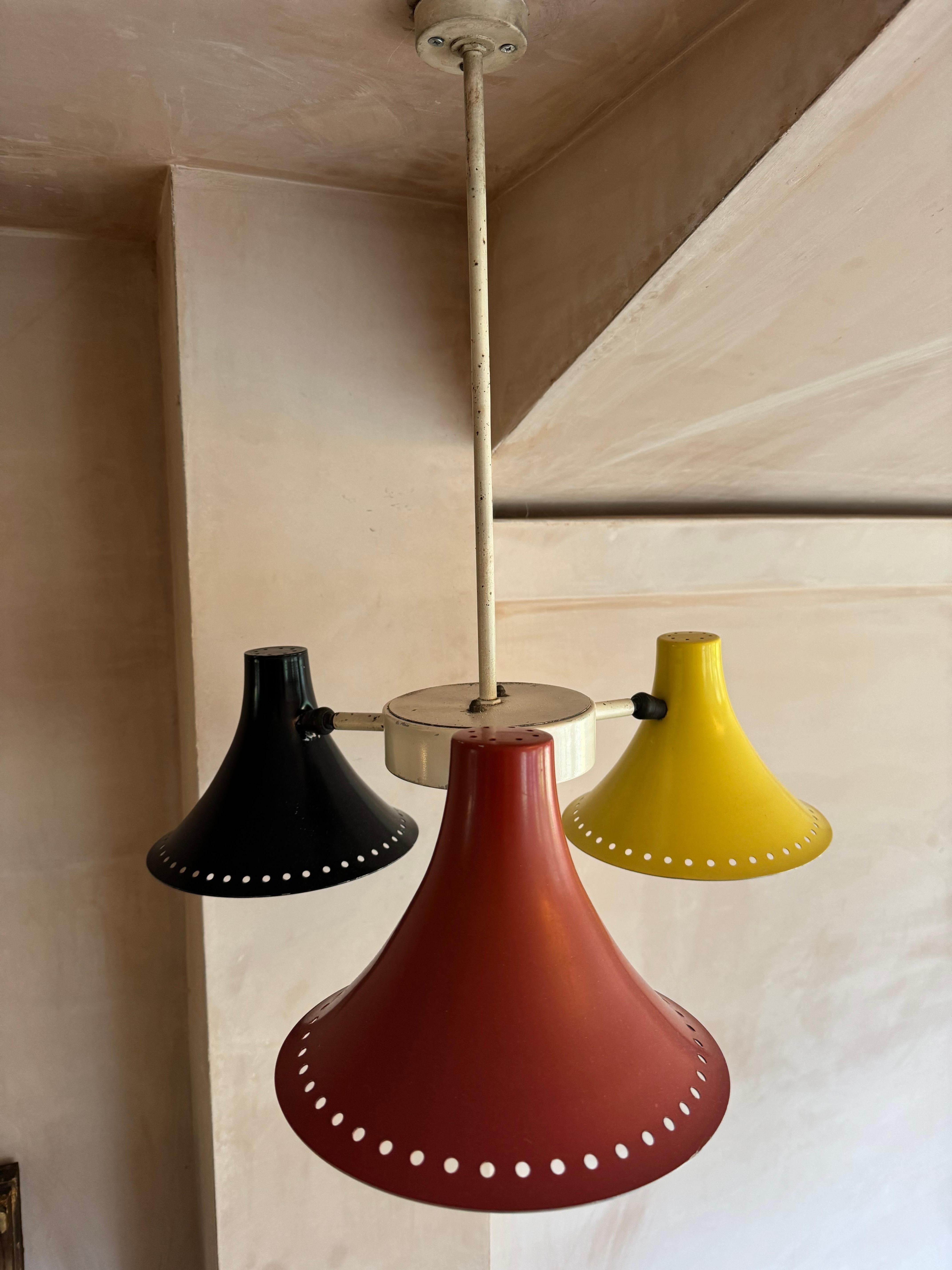 Painted Three armed 1950’s red, black, yellow ceiling light. For Sale