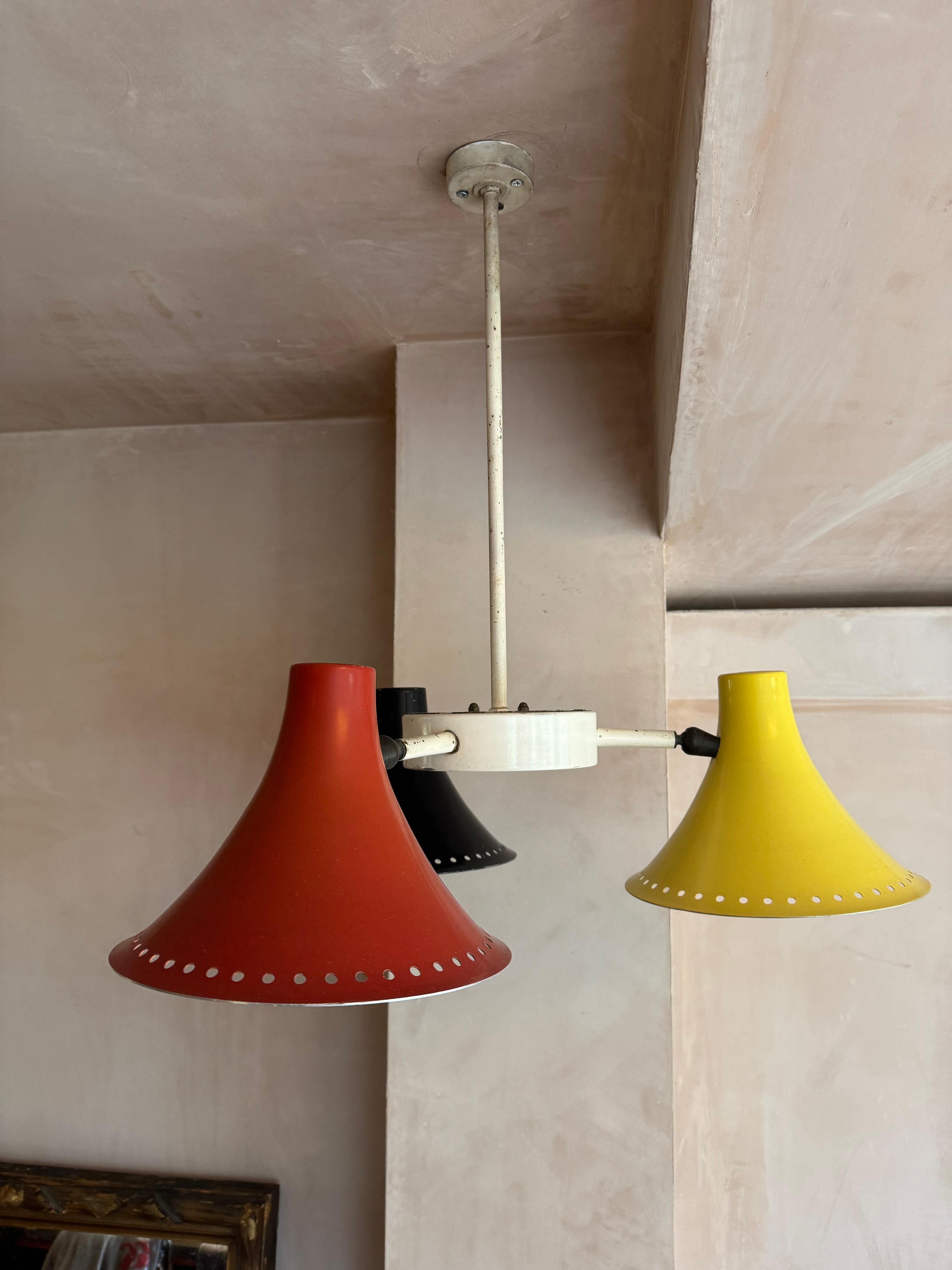 Metal Three armed 1950’s red, black, yellow ceiling light. For Sale