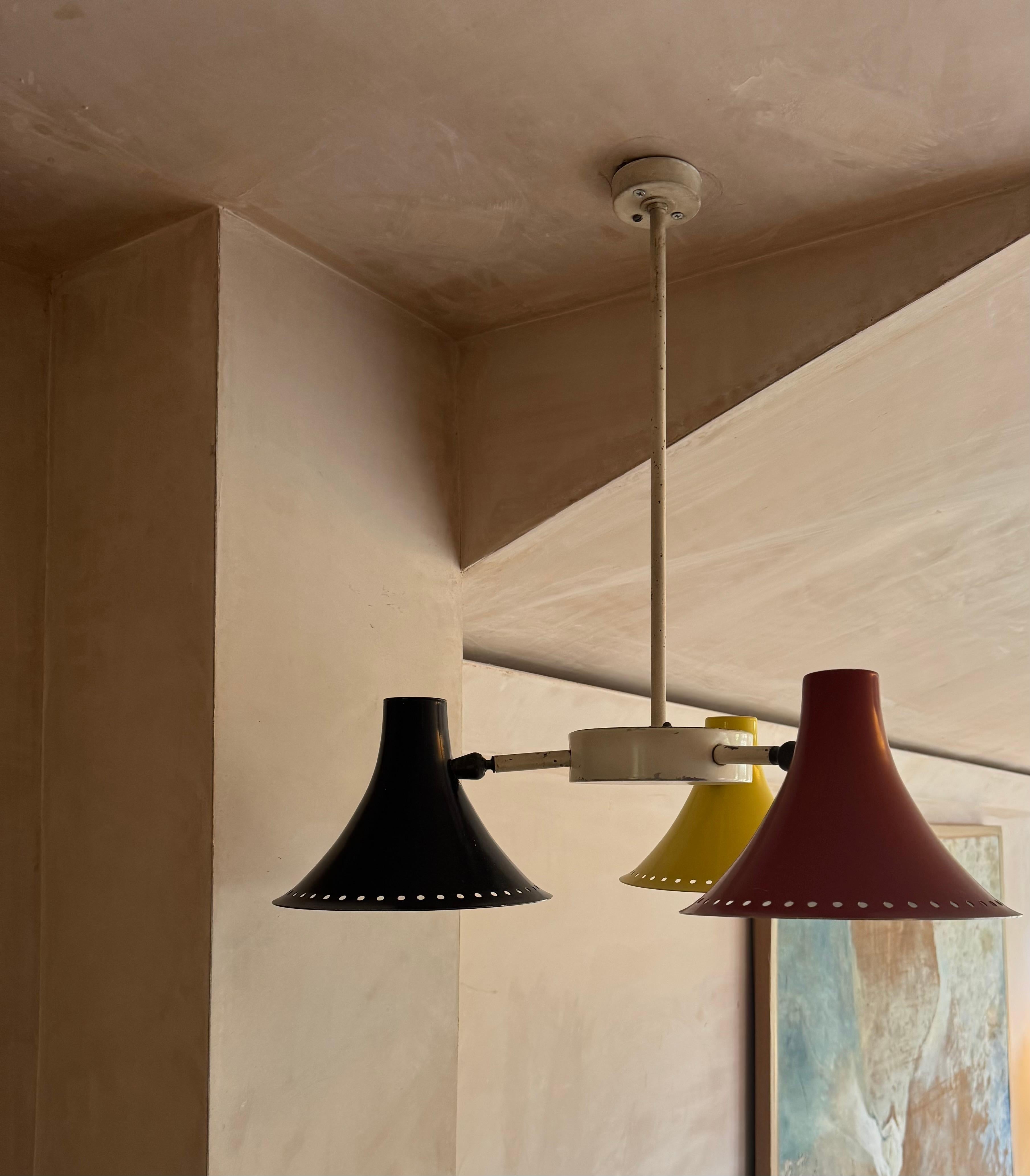 Three armed 1950’s red, black, yellow ceiling light. For Sale 1